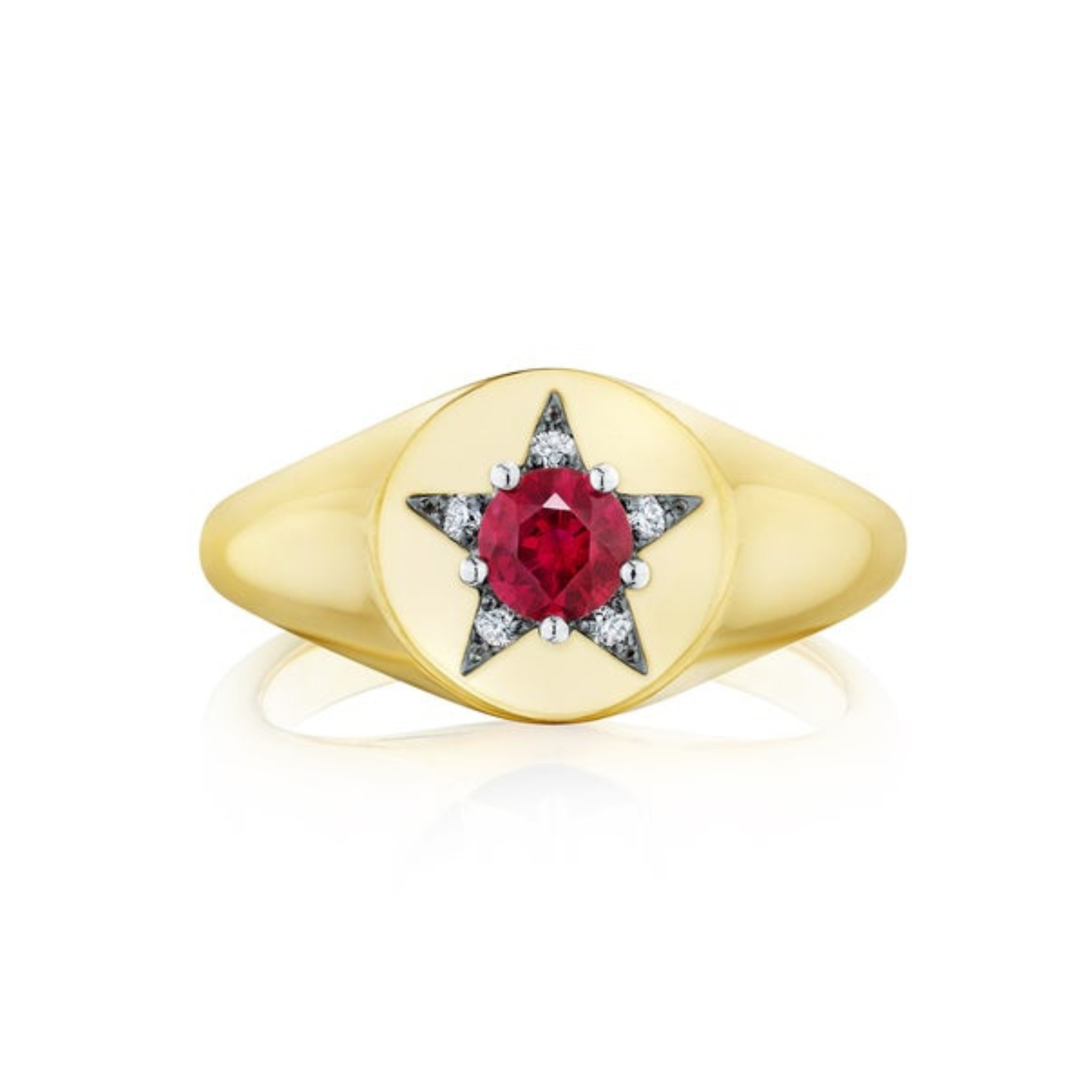 The America250 Star Signet Ring in Yellow Gold and Platinum features a central round red gemstone set in a star-shaped design, accented with small white stones on a smooth, polished band.