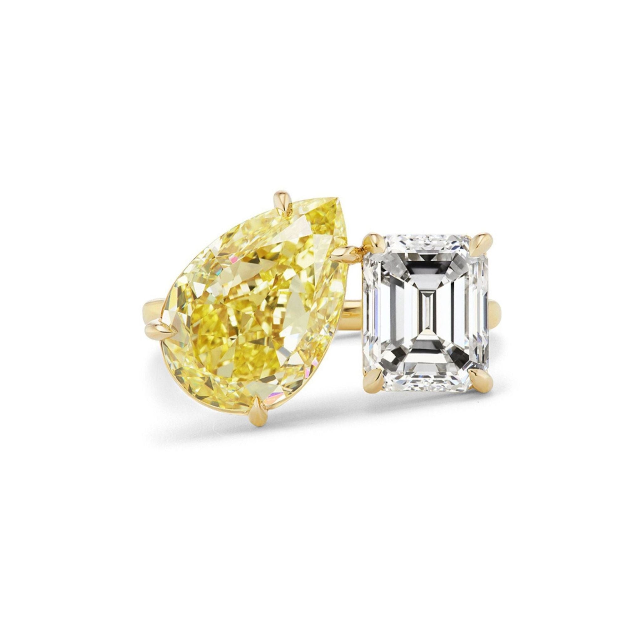 The Toi et Moi Ring with Fancy Yellow Pear and White Emerald Cut Diamonds features two striking gemstones—a pear-shaped fancy yellow diamond and a rectangular emerald-cut white diamond—set side by side, creating a stunning bespoke engagement ring ideal for those seeking something truly unique.