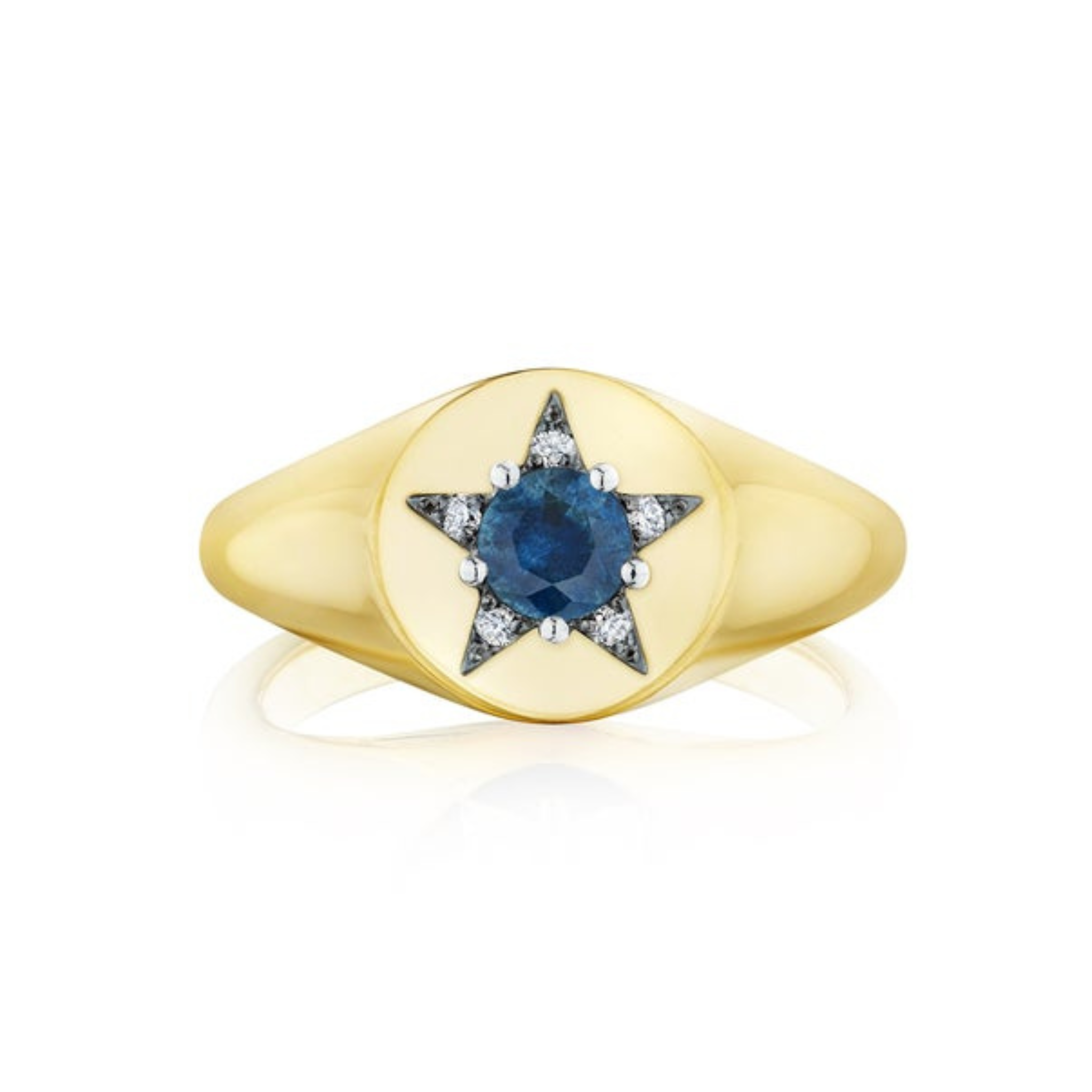 The America250 Star Signet Ring in yellow gold and platinum features a round blue gemstone at the center of a star-shaped design with small white stones on a smooth, oval face.