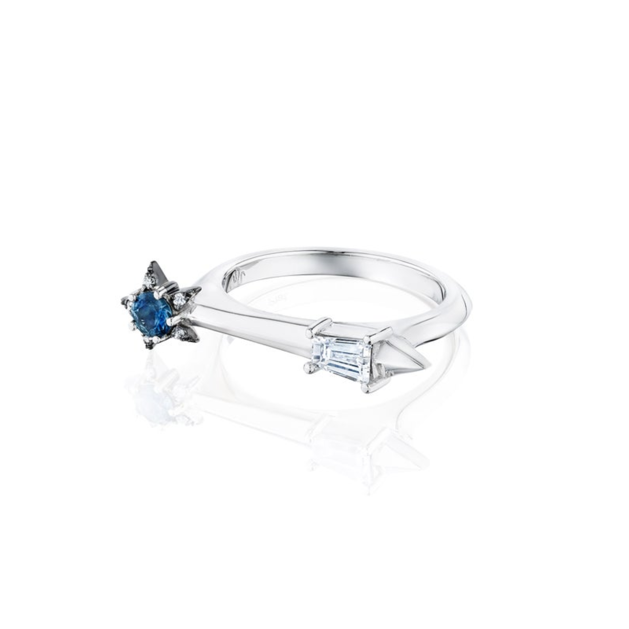 The America250 Star and Baguette Sapphire and Diamond Ring in Platinum features an open design with a blue star-shaped sapphire and a rectangular diamond—an elegant choice for fans of customizable gemstone jewelry.