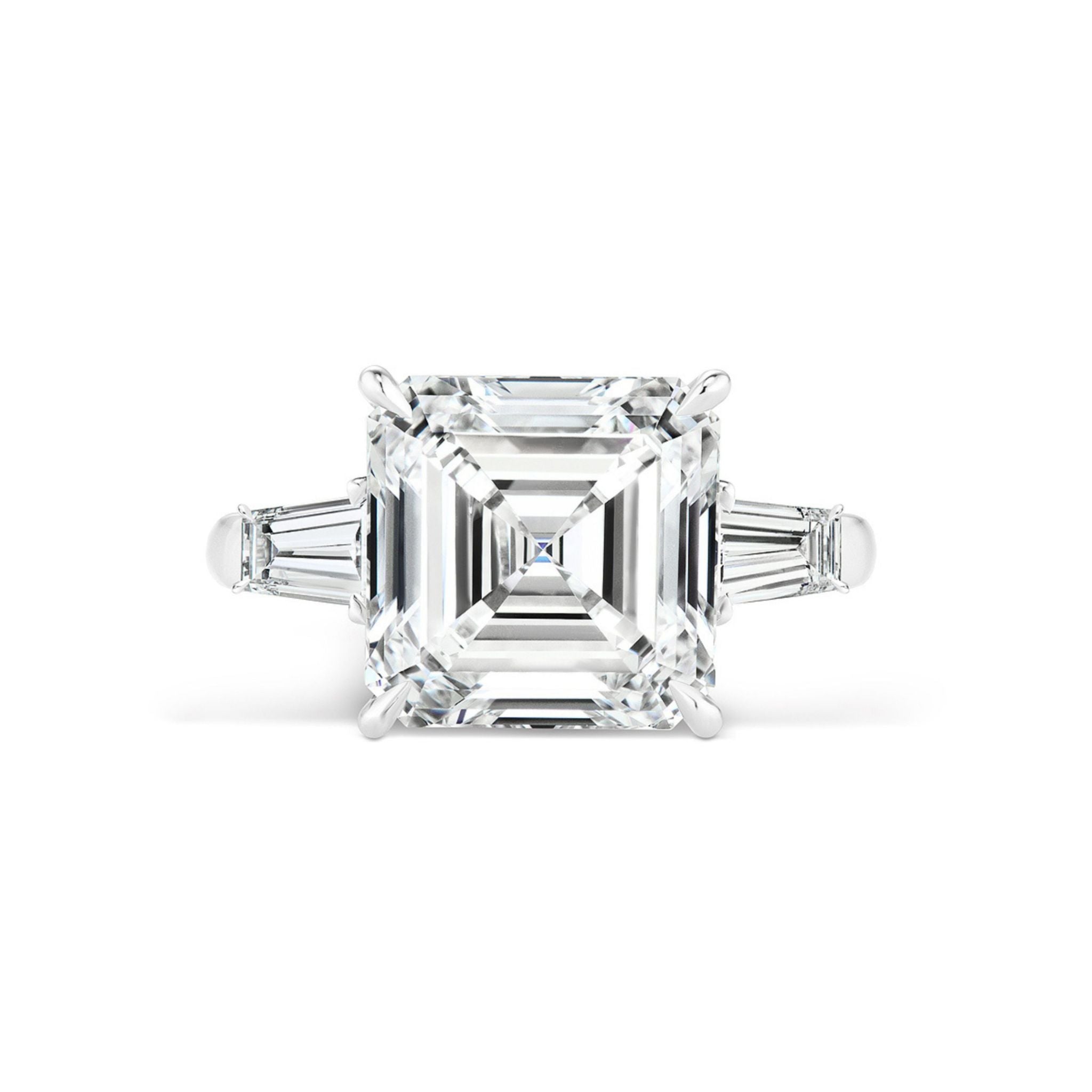 The Asscher Cut Diamond Engagement Ring with Tapered Baguette Side Stones showcases a striking square-cut diamond at its center, complemented by tapered baguette diamonds on each side—an ideal choice for anyone seeking timeless elegance in their bridal ring.