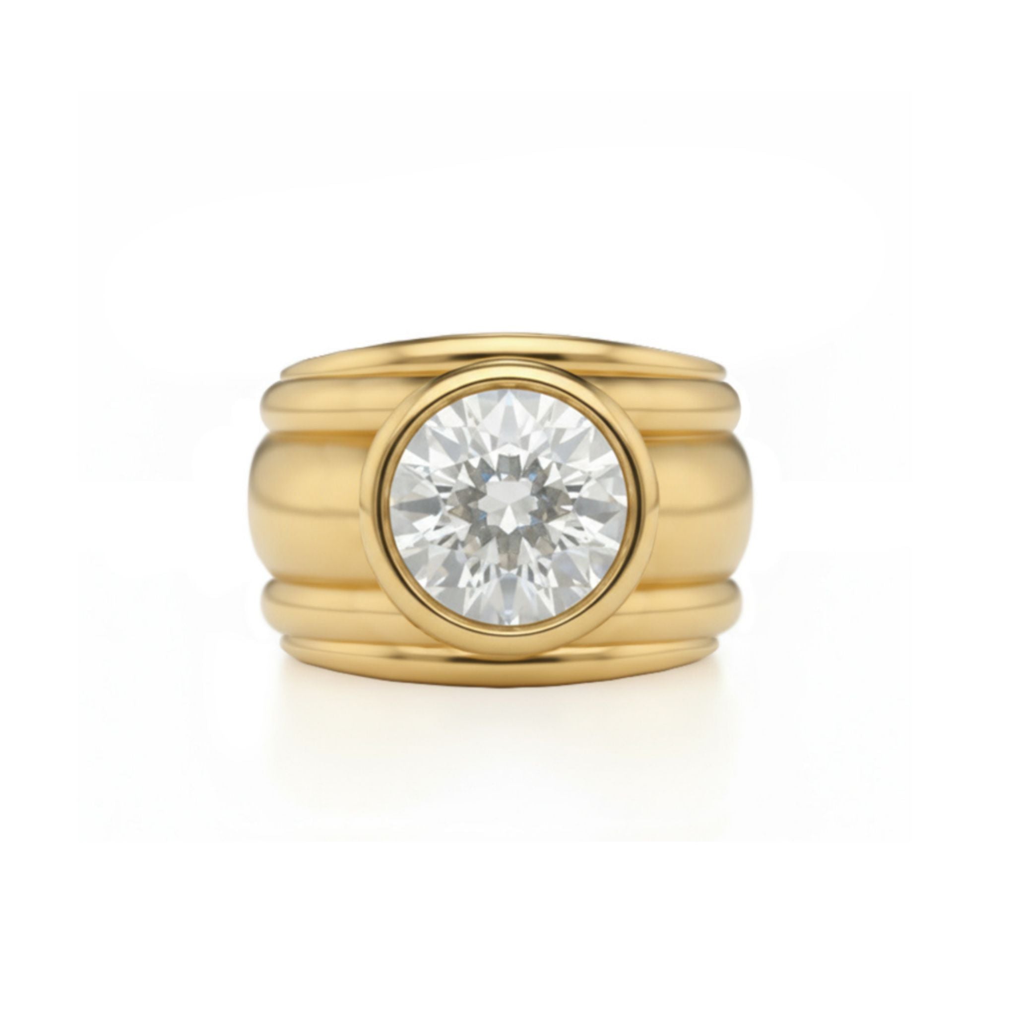 The Chunky Bezel Set Round Diamond Engagement Ring in Yellow Gold showcases a wide band crafted from yellow gold, featuring a large round-cut diamond in a secure bezel setting, with a smooth polished finish and grooved detailing along the band.