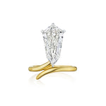 The Shield Diamond Perch Engagement Ring in Yellow Gold features a large, uniquely cut shield diamond set vertically in a prong setting on a twisted yellow gold band, displayed against a white background.