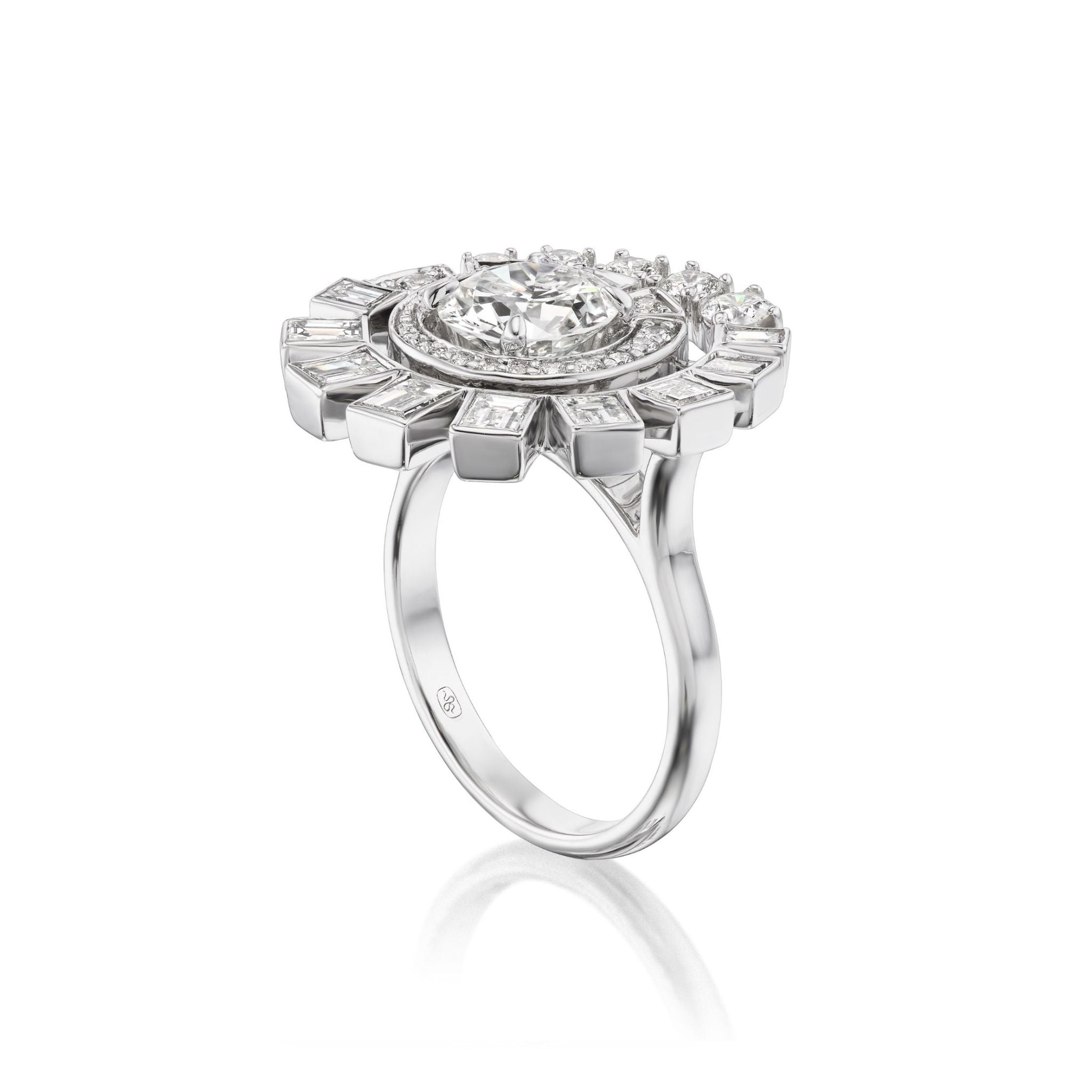 Introducing the Spiral Ring in White Gold with Round Brilliant and Baguette Diamonds—a captivating 18k white gold piece showcasing a prominent round brilliant diamond at its center, elegantly encircled by an array of smaller round brilliant and baguette diamonds arranged in a striking spiral design reminiscent of a floral or sunburst motif, set against a pristine white background.