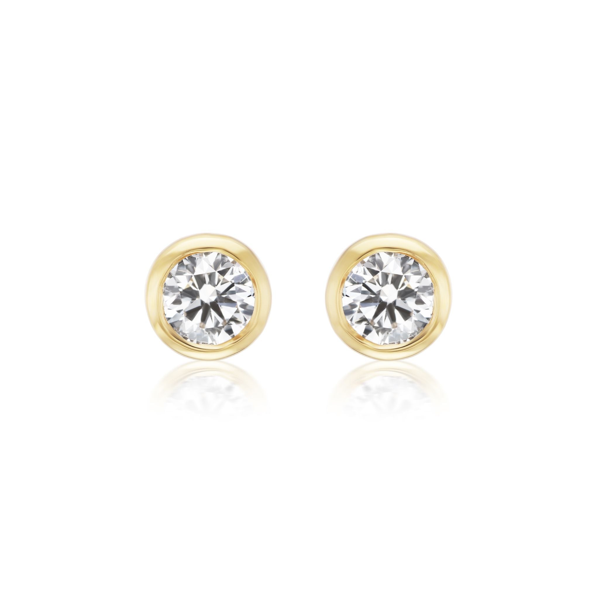 Bezel Set Round Diamond Studs in Yellow Gold, featuring G-H color diamonds in round bezels, displayed on a white background.