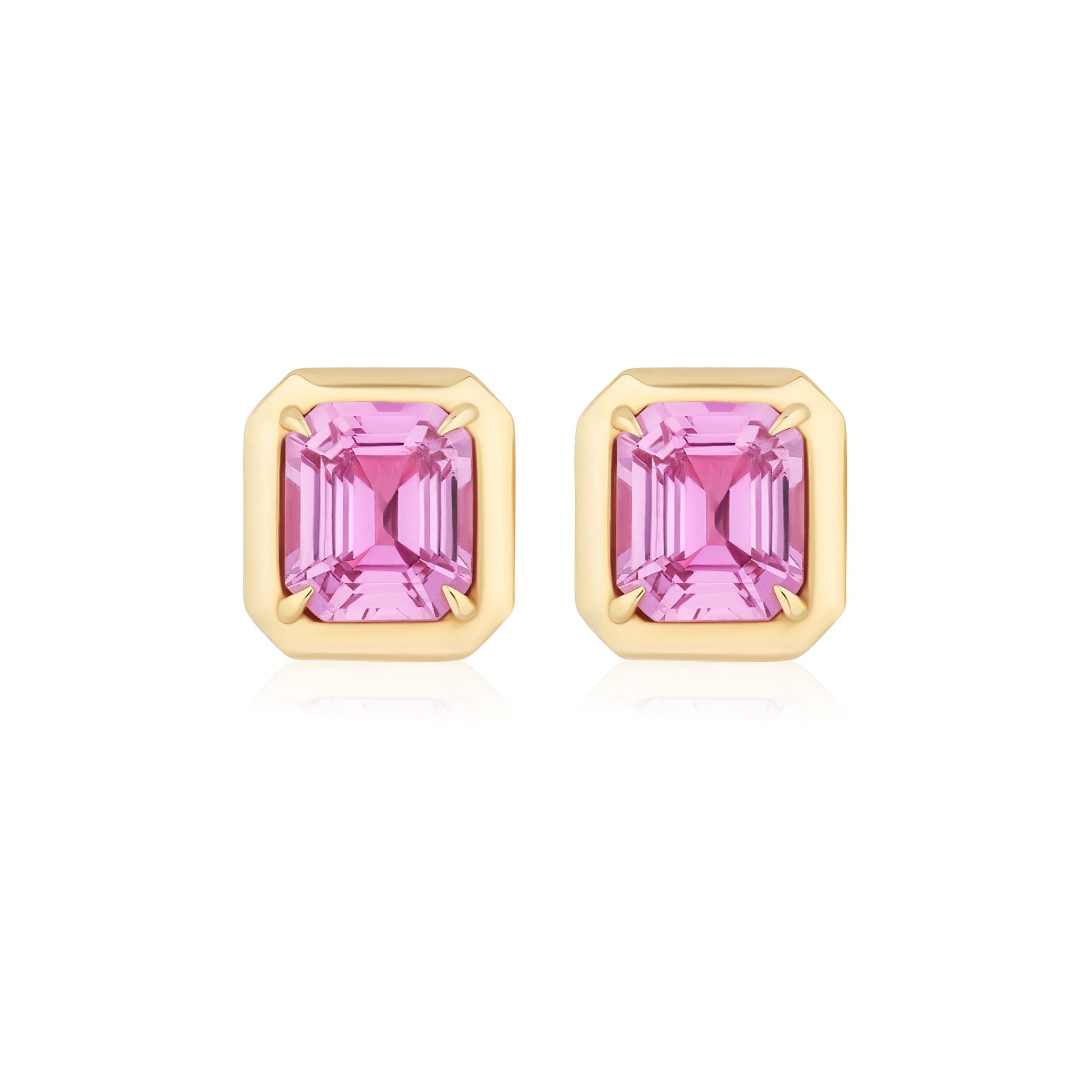 The Asscher Cut Pink Sapphire Studs in Yellow Gold feature Asscher cut pink sapphires set in a four-prong 18k yellow gold setting, shown on a white background.