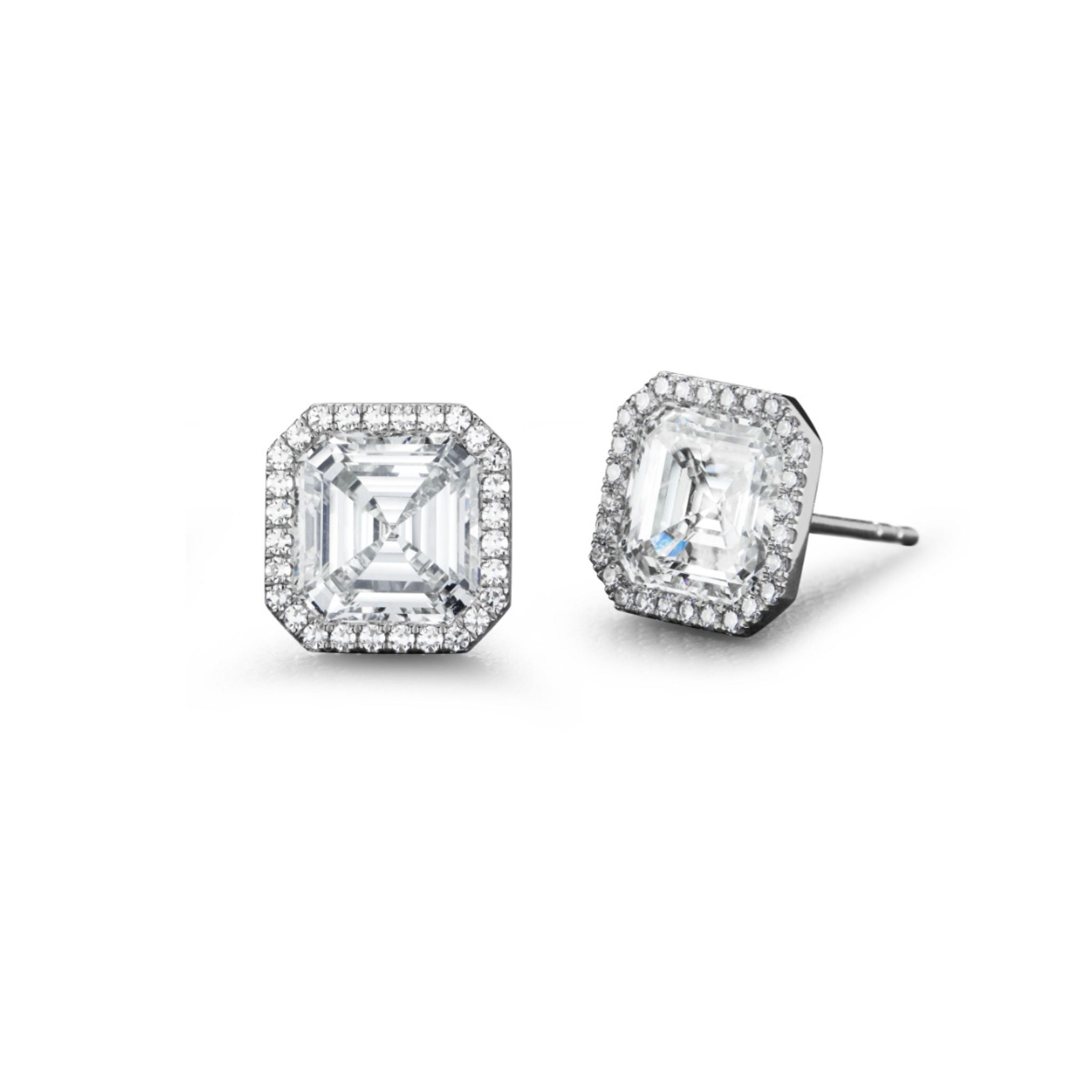 The Pavé Studs in White Gold with Asscher Cut Diamonds showcase a pair of square, Asscher cut diamonds at the center, elegantly framed by a pavé border of smaller round diamonds and set in luxurious 18k white gold.