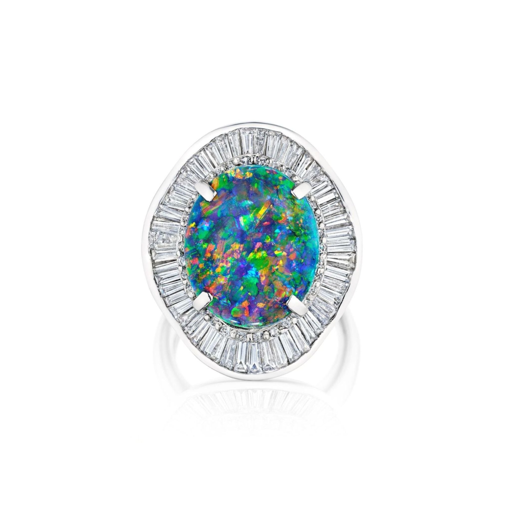 Introducing the 1980s Opal and Diamond Ring: a platinum silver statement piece showcasing a large round opal with vibrant blue, green, and orange hues, encircled by a halo of baguette-cut clear diamonds for an exceptionally stunning design.