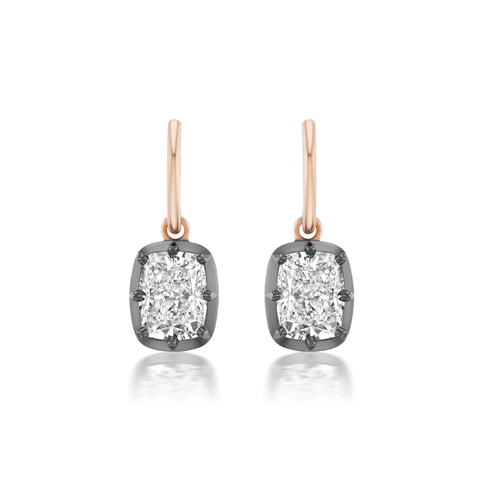 The Collet Set Cushion Cut Diamond Earrings in Black Rhodium and Rose Gold feature dazzling cushion-cut diamonds set in dark, luxurious black rhodium frames and suspended from elegant 18k rose gold hooks, beautifully displayed against a white background.