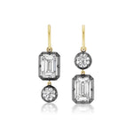 Collet Set Emerald Cut and Round Diamond Drop Earrings in Yellow Gold and Black Rhodium: crafted in 18k yellow gold, each earring showcases an emerald-cut diamond and a round diamond set in contrasting black rhodium prongs, with the placement of each stone reversed for asymmetrical elegance. Both emerald cut diamonds are GIA certified, ensuring outstanding quality and brilliance.
