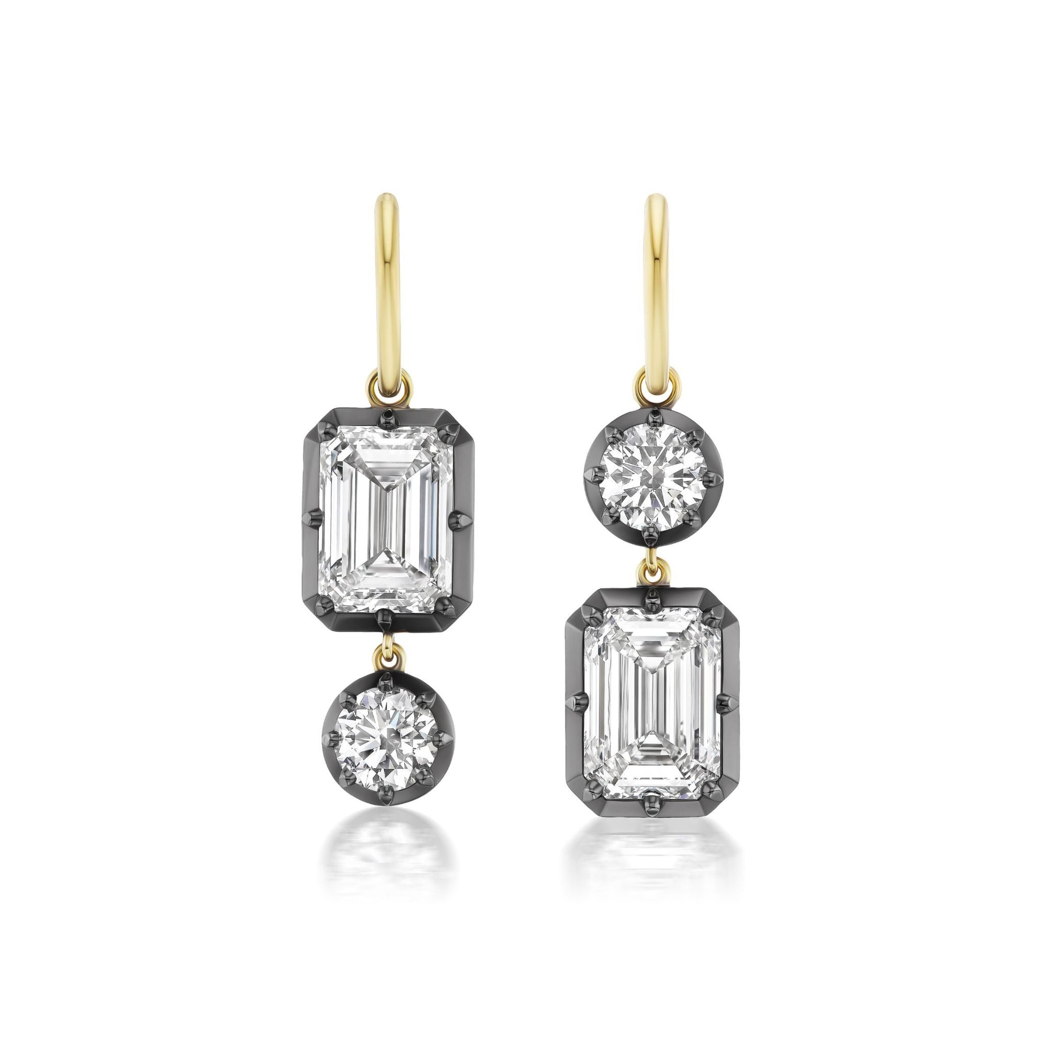 Collet Set Emerald Cut and Round Diamond Drop Earrings in Yellow Gold and Black Rhodium: crafted in 18k yellow gold, each earring showcases an emerald-cut diamond and a round diamond set in contrasting black rhodium prongs, with the placement of each stone reversed for asymmetrical elegance. Both emerald cut diamonds are GIA certified, ensuring outstanding quality and brilliance.