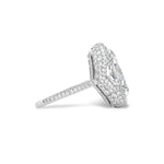 Side view of the Cobblestone Pavé Basket Ring with Oval Diamond and Epaulette Diamond Side Stones, featuring an elegant oval center stone accented by smaller diamonds set into the pavé basket setting and band, all crafted in white metal.