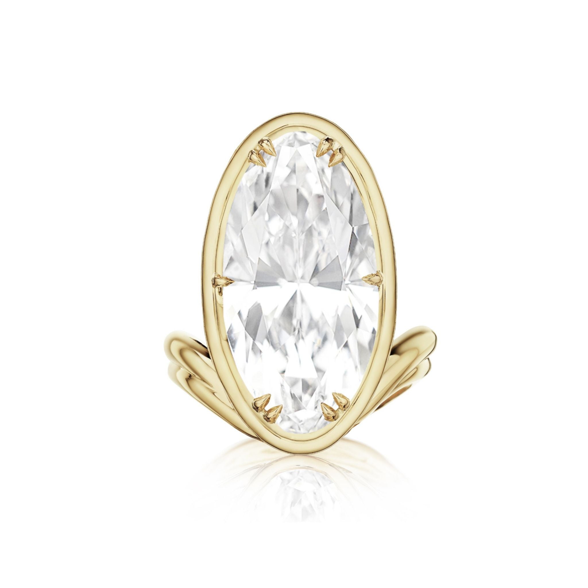 Introducing the Collet Set Elongated Oval Diamond Perch Engagement Ring in 18k Yellow Gold—a breathtaking engagement ring showcasing a vertically set, elongated oval diamond in a sleek, modern band of rich yellow gold.