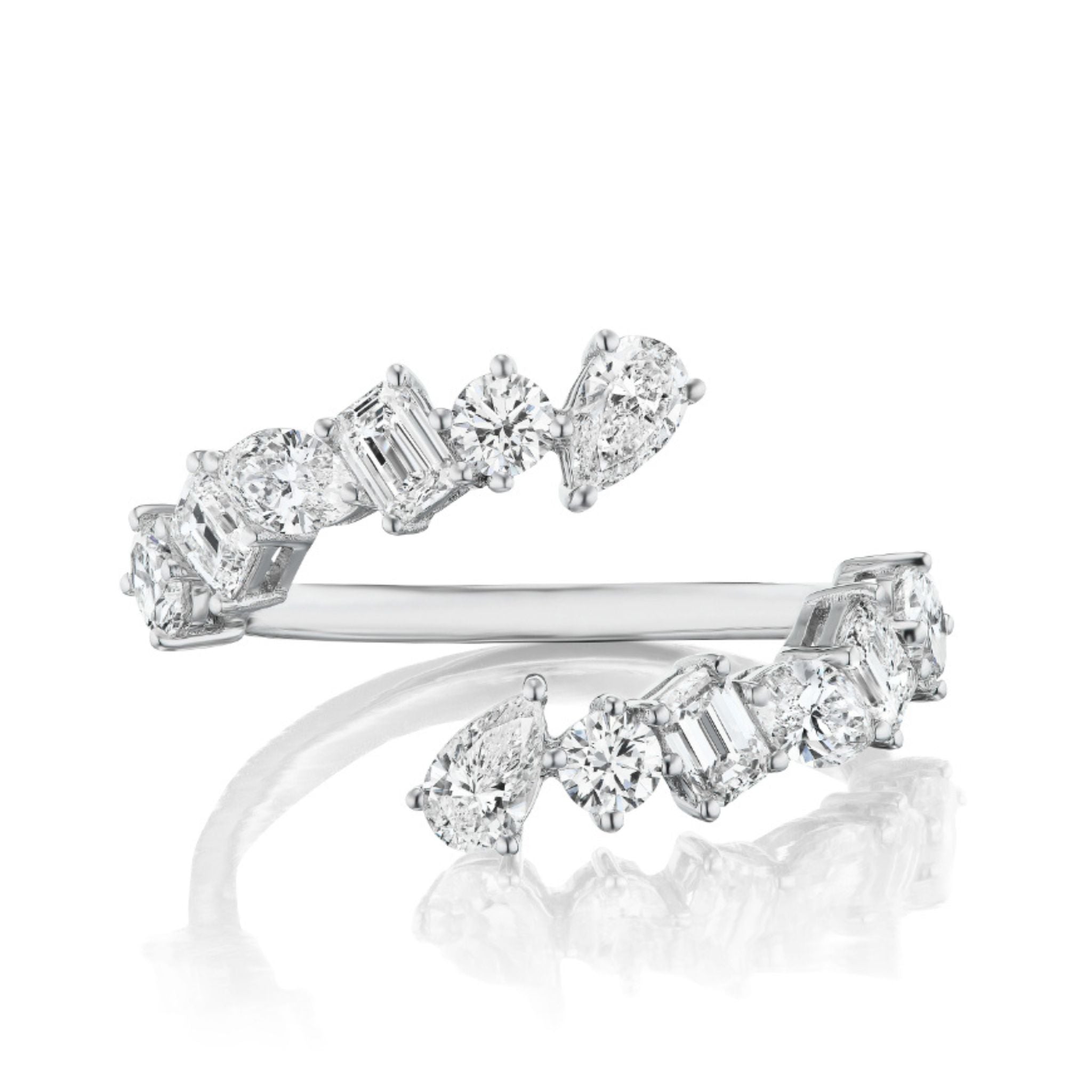 The Wraparound Ring with Mixed Shape Diamonds features alternating round, emerald, and pear-shaped diamonds set along an open 18K gold or platinum band with a reflective underside for added brilliance.