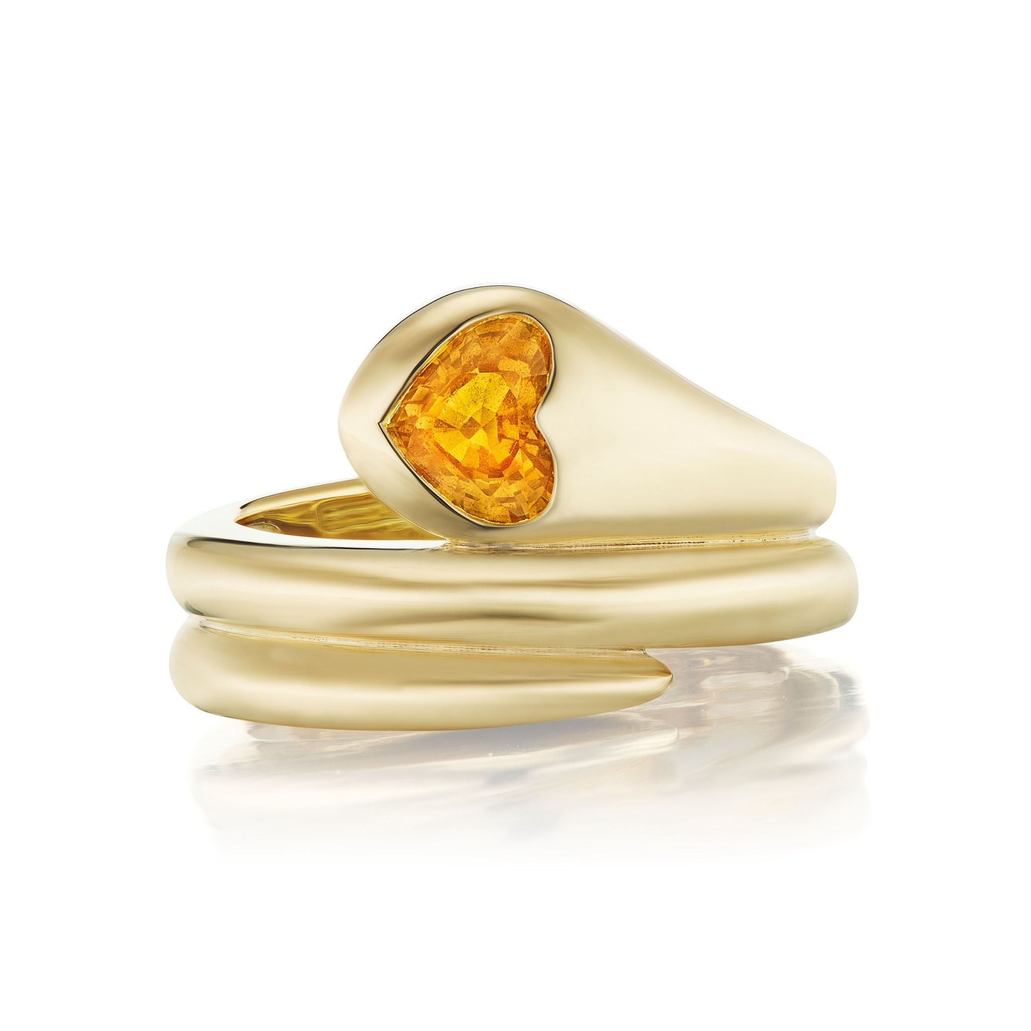 A Wraparound Snake Ring in yellow gold, featuring a modern coiled design and an orange heart-shaped sapphire set at the top.