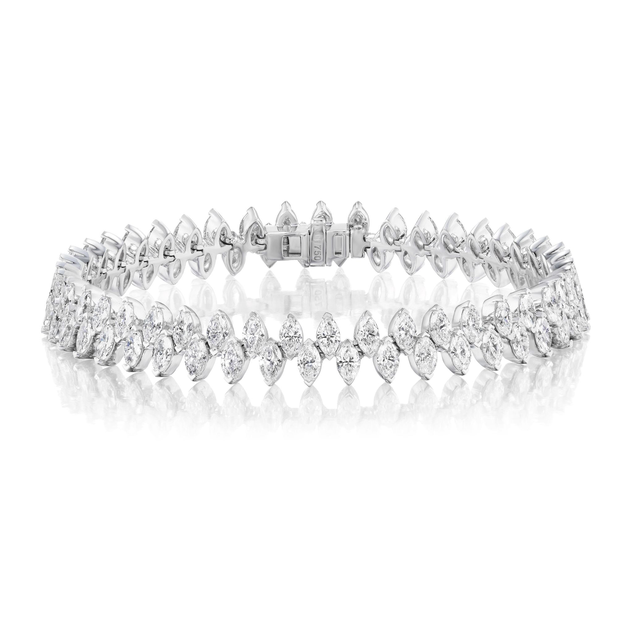 The Zigzag Marquise Diamond Tennis Bracelet in White Gold features double rows of marquise and round-cut diamonds set in 18k white gold, arranged elegantly with a box clasp. Length: 6.5 inches.