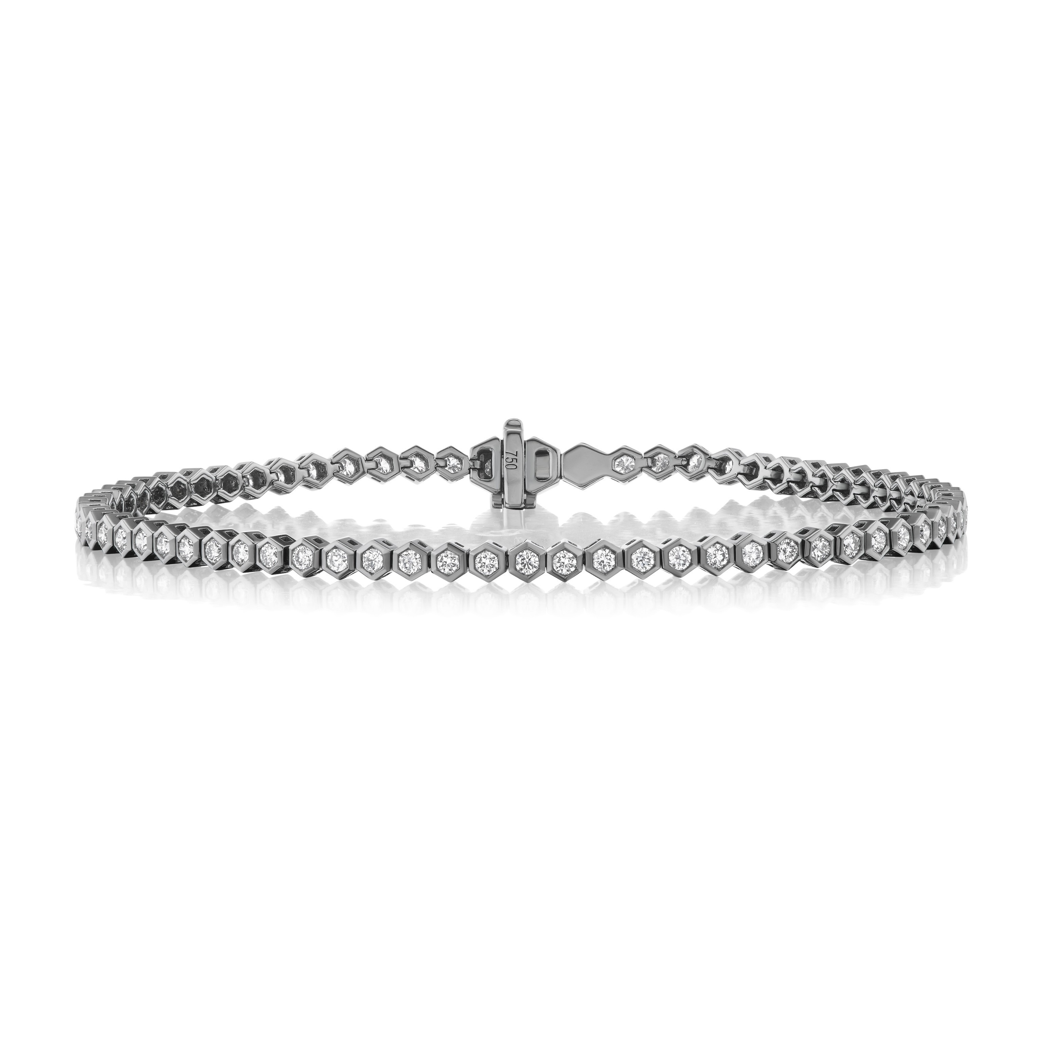 The Black Rhodium Hexagon Bezel Set Diamond Tennis Bracelet features round brilliant diamonds in hexagon bezel settings and a secure clasp, all crafted in black rhodium, displayed against a white background.