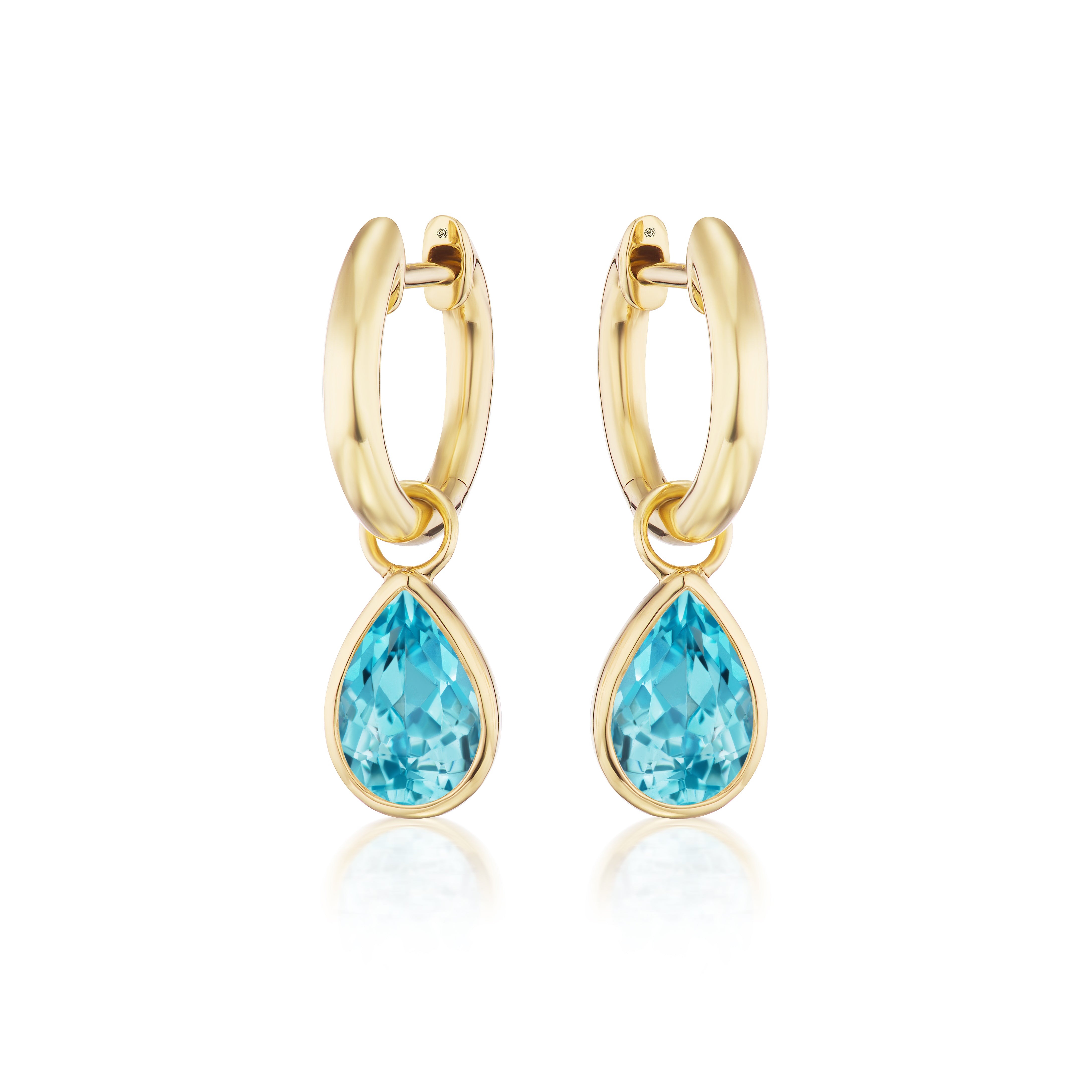 Huggies with Pear Shape Aquamarine: Pair of 18K yellow gold hoop earrings featuring dangling pear-shaped aquamarine gemstones in gold bezels, shown against a white background.