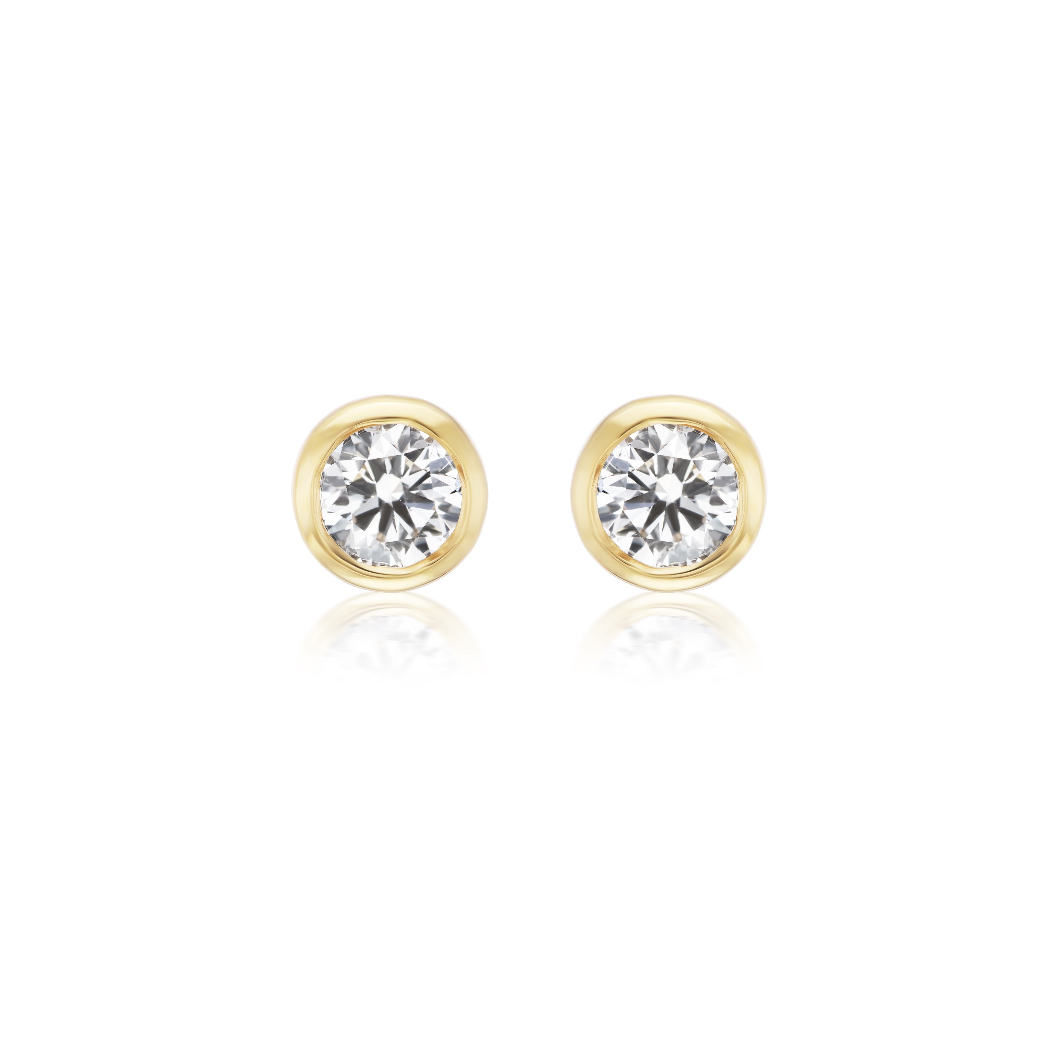 Bezel Set Round Diamond Studs in Yellow Gold, featuring round diamonds set in 18k yellow gold bezel settings, shown on a white background.