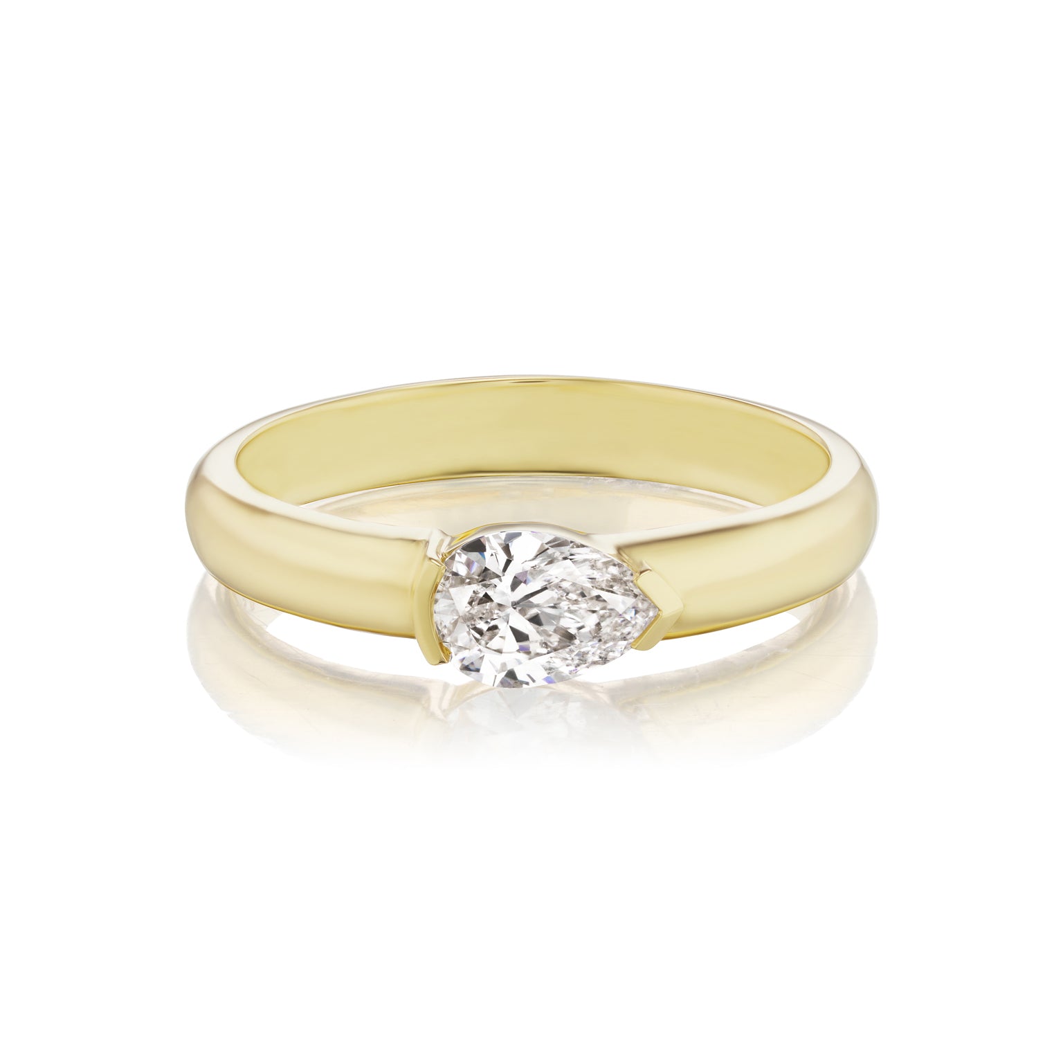 The East-West Pear Diamond Solitaire Band features a single pear-shaped diamond set in yellow 18k gold, showcased against a white background.