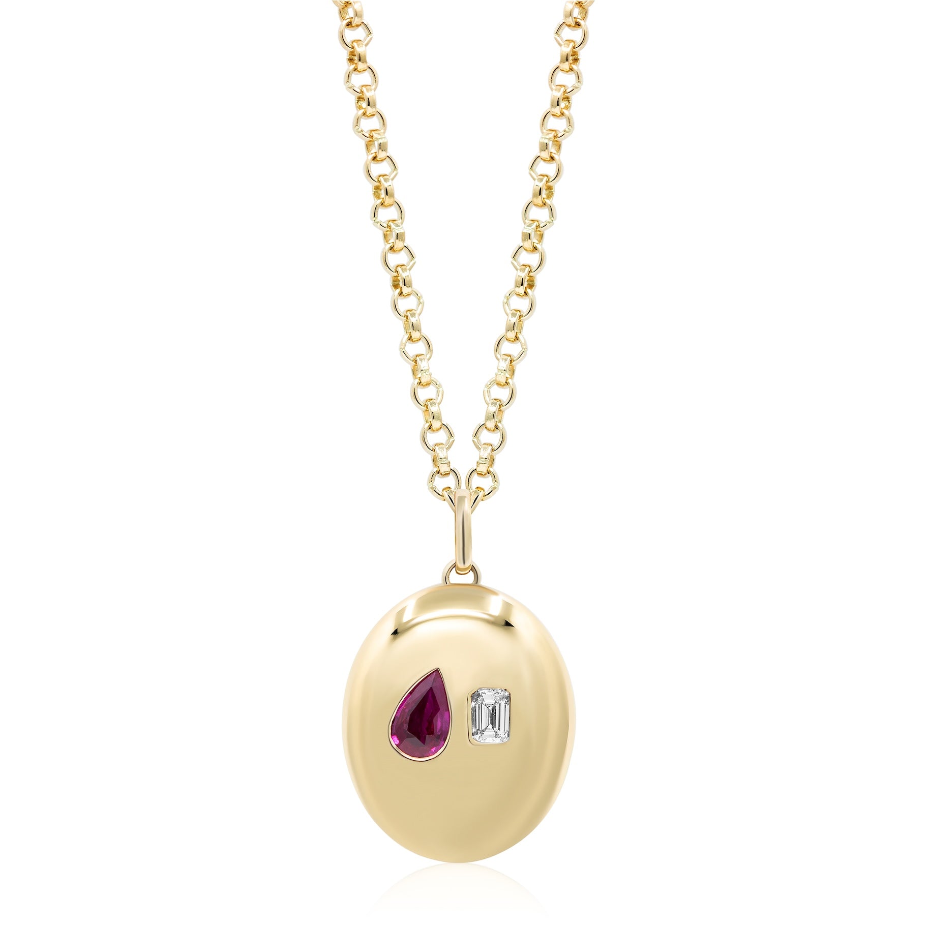 The Bespoke Burnish Set features a pear-shaped ruby and an emerald cut diamond set in yellow gold on a gold chain.