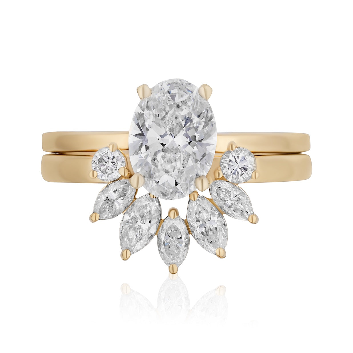 The Bespoke Marquise and Round Diamond Ring Jacket in Yellow Gold features an oval-cut diamond center with a curved cluster of marquise and round diamonds, paired with a sleek yellow gold ring jacket for extra elegance.