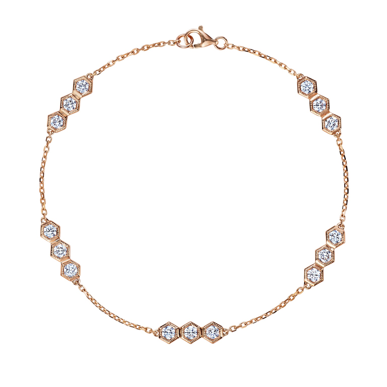 The Serpentine Station Bracelet with Hexagon Diamond Trios features 18k gold with hexagon-shaped stations, each set with sparkling round diamonds, evenly spaced along a fine chain and secured by a lobster clasp.