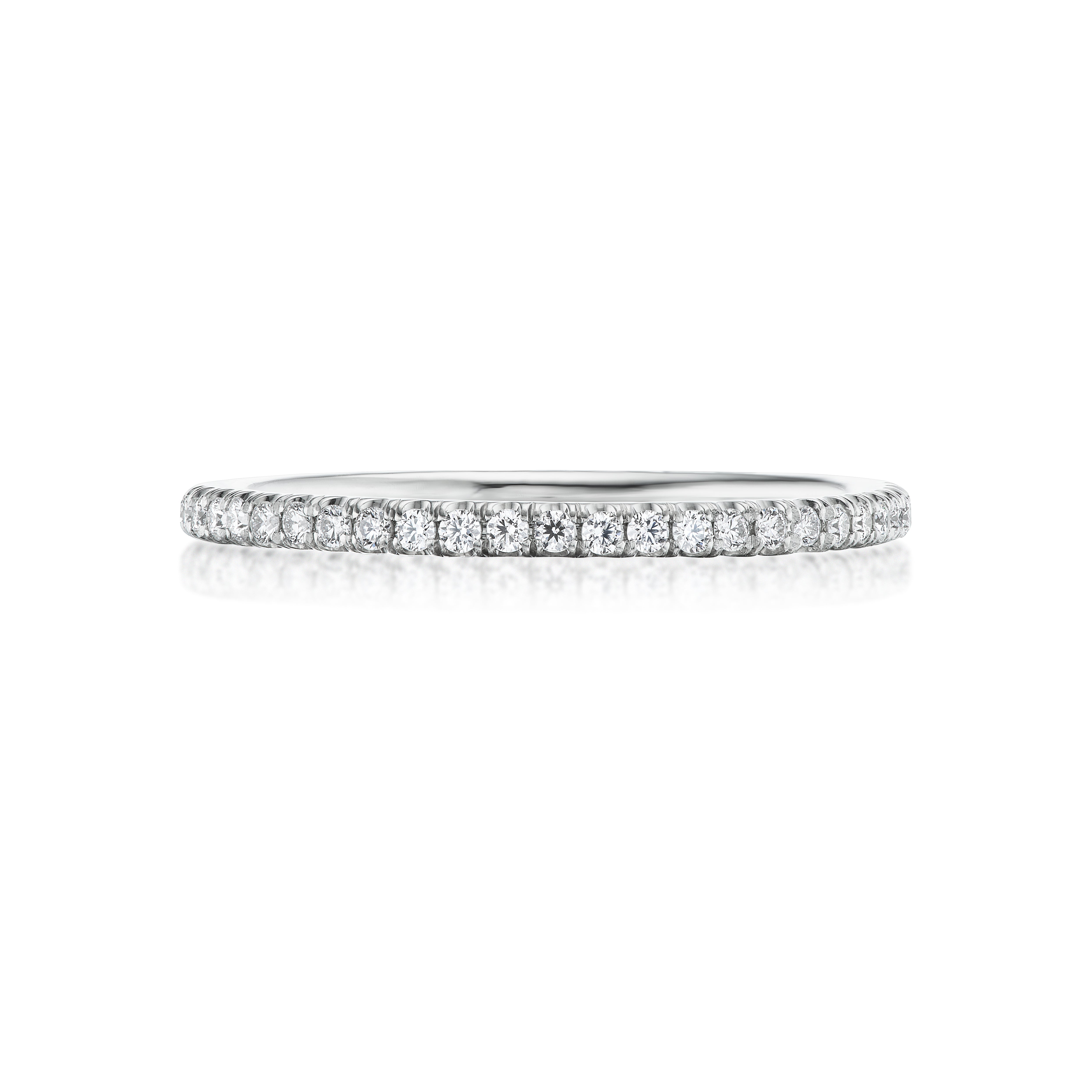 The Round Diamond Eternity Band is crafted in 18K white gold or platinum with a continuous row of small round diamonds set along the band, shown against a white background.
