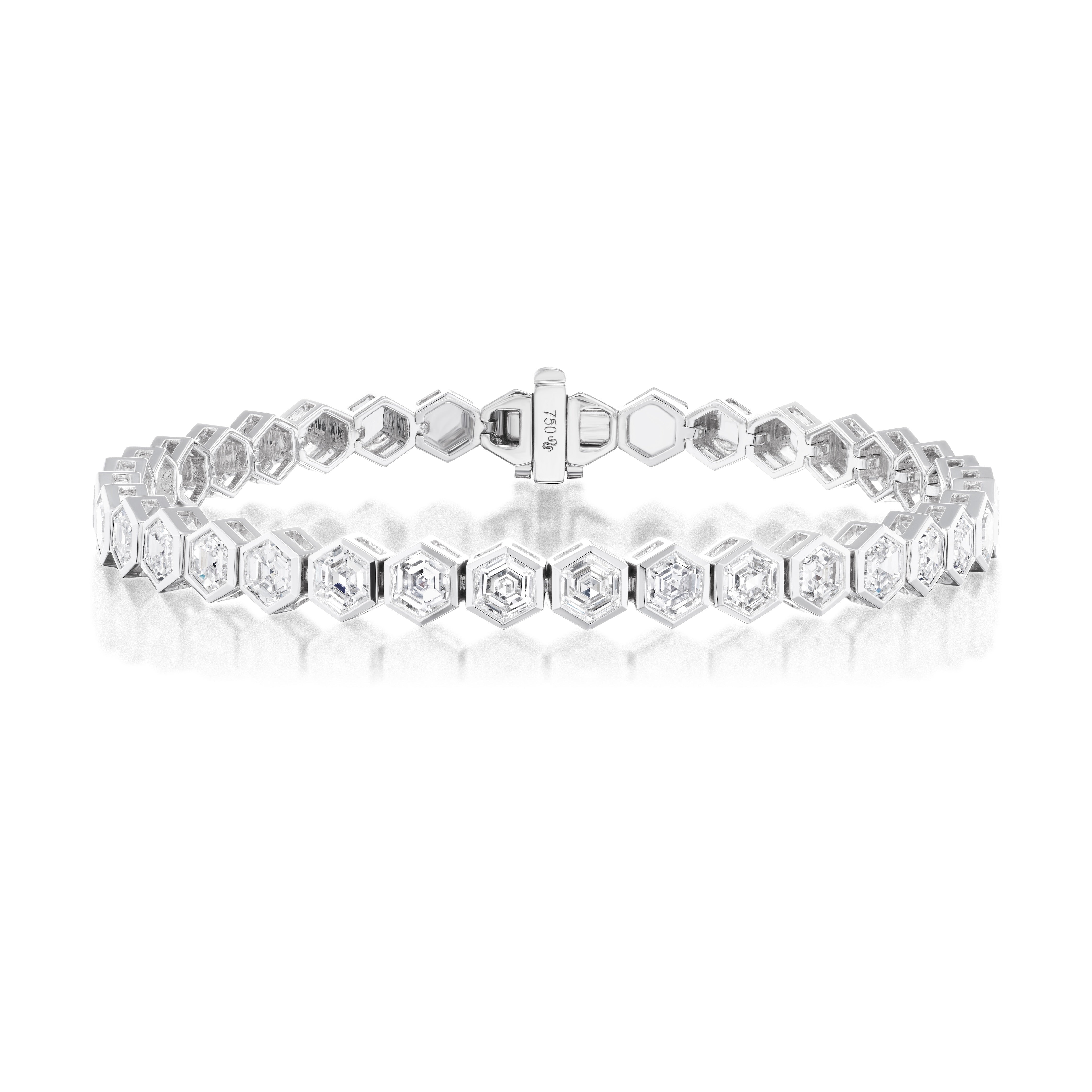 The Medium Hexagon Bezel Set Diamond Tennis Bracelet in White Gold features 5.63ctw hexagon diamonds in bezel-set hexagonal links, beautifully displayed against a white background.