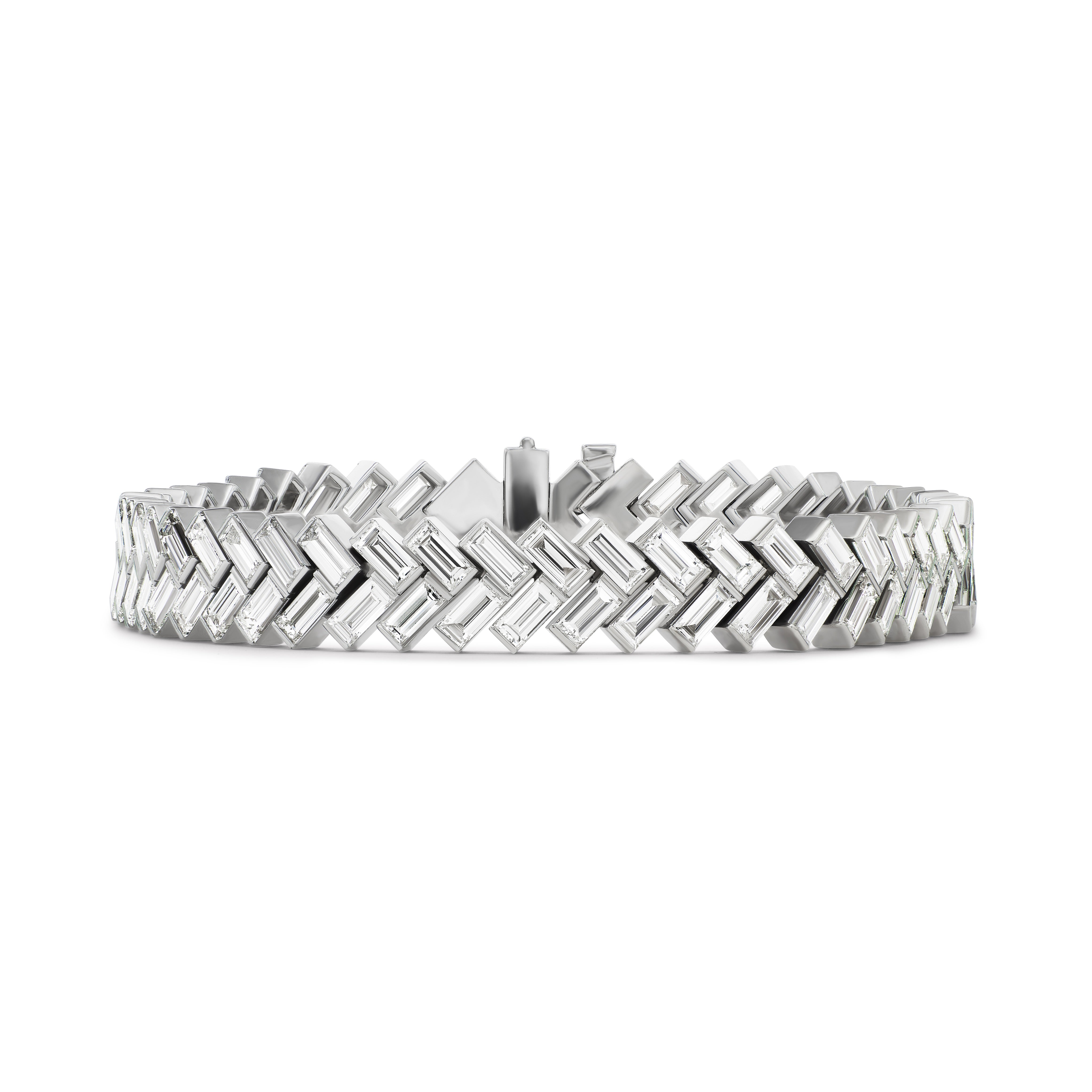 The Bezel Set Chevron Diamond Tennis Bracelet in White Gold features interlocking chevron-shaped links for a striking geometric look.