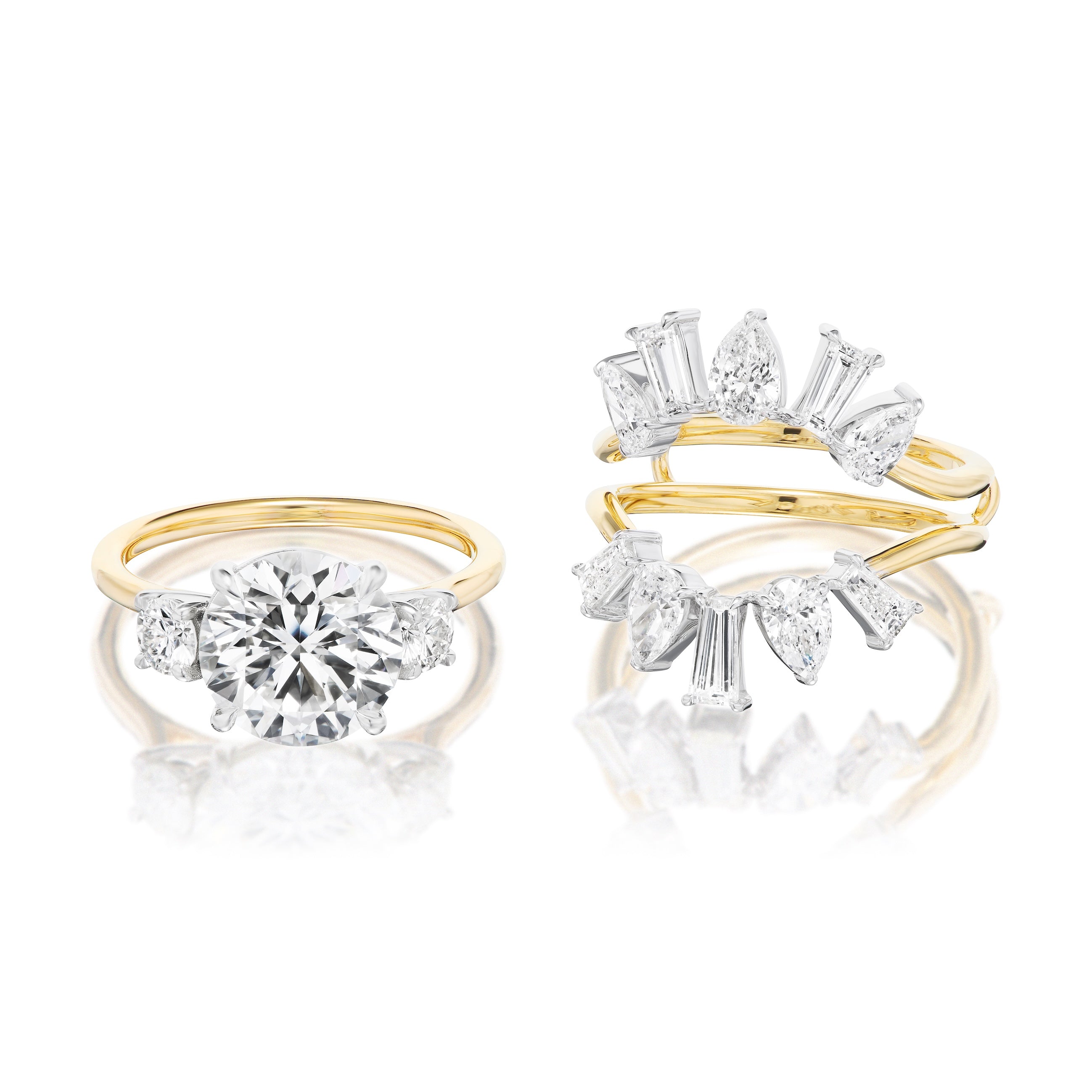 Two gold rings: one features a round-cut diamond with two side stones, while the other has an open band and crown design—ideal to pair with the Bespoke Confetti Diamond Ring Jacket in White and Yellow Gold or other customizable jewelry.