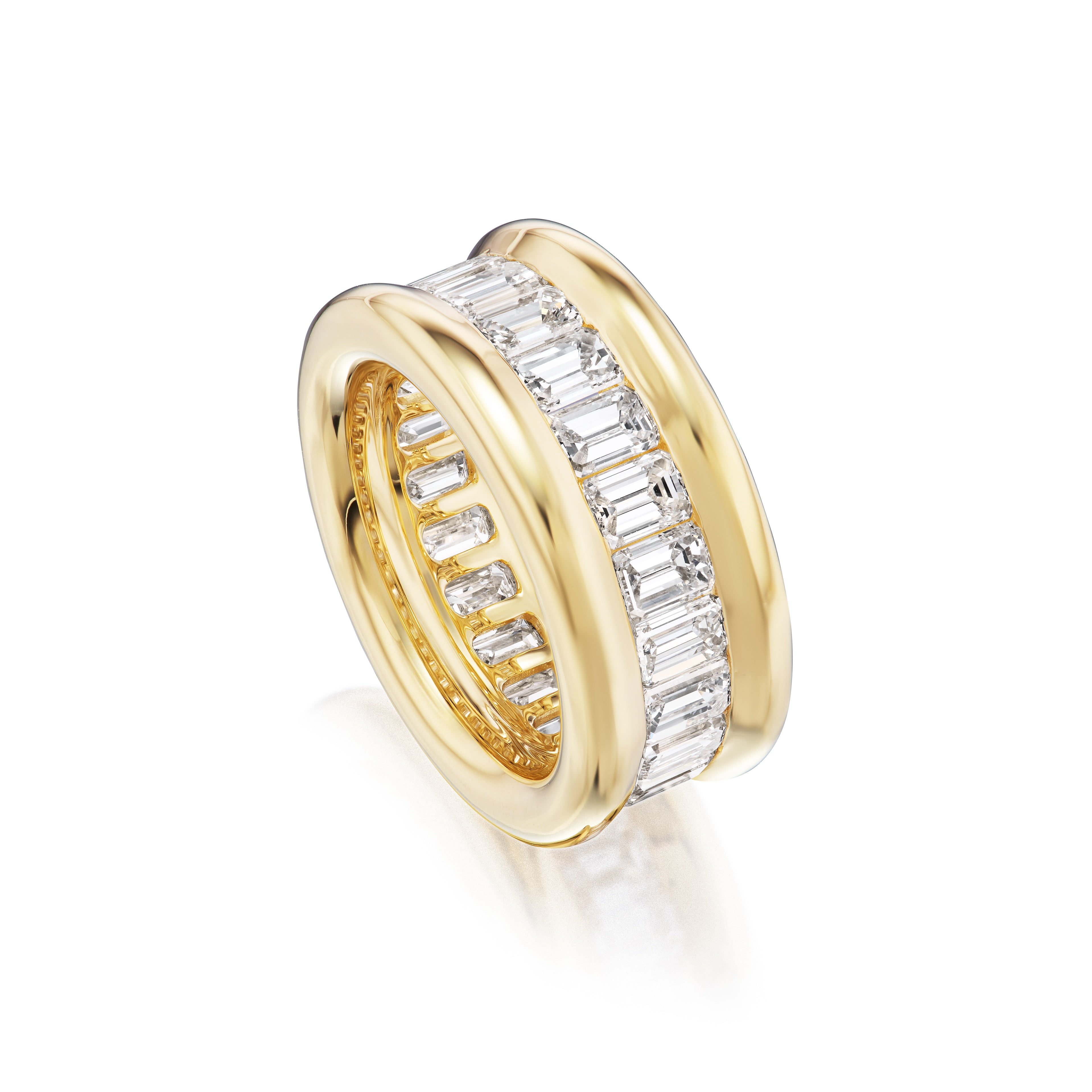The Channel Set Emerald Cut Diamond Eternity Band features a wide 18K yellow gold band with a central row of vertically set emerald cut diamonds and smooth, polished gold edges.