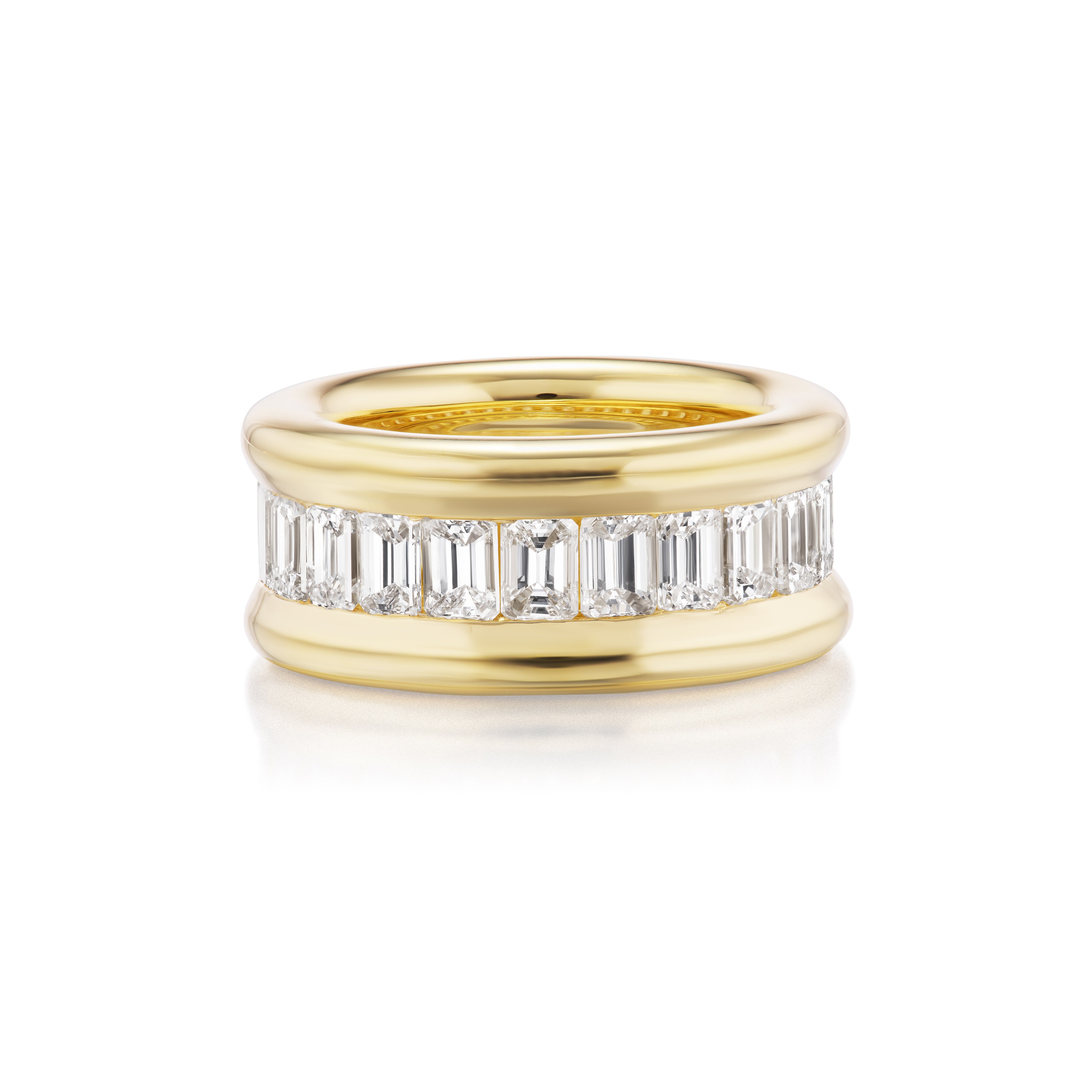 The Channel Set Emerald Cut Diamond Eternity Band features a wide 18K yellow gold band with a continuous row of emerald cut diamonds set in a channel, accented by polished gold edges.