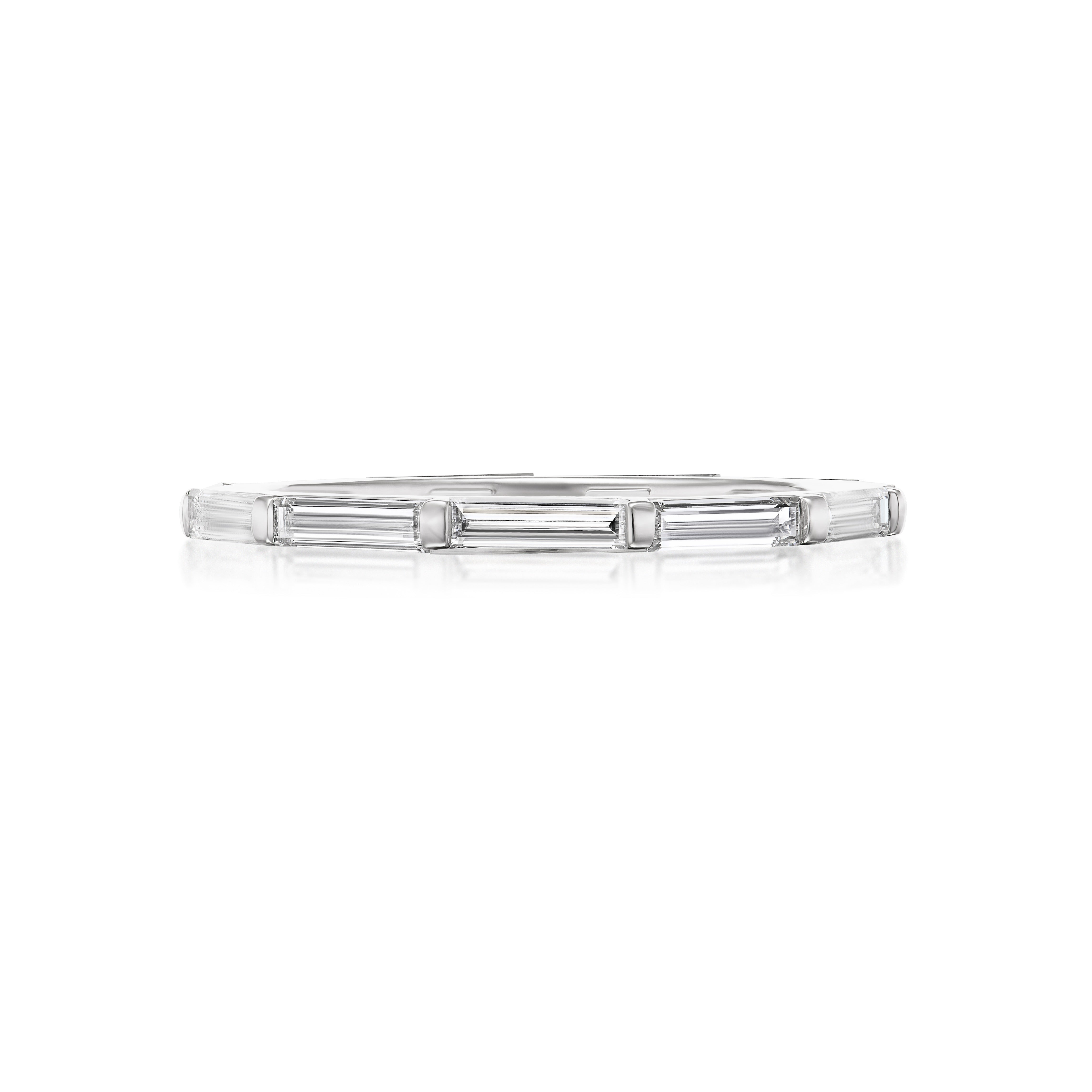 The East-West Thin Baguette Cut Diamond Eternity Band is a delicate silver ring with rectangular baguette diamonds set side by side along the band, displayed on a white background.