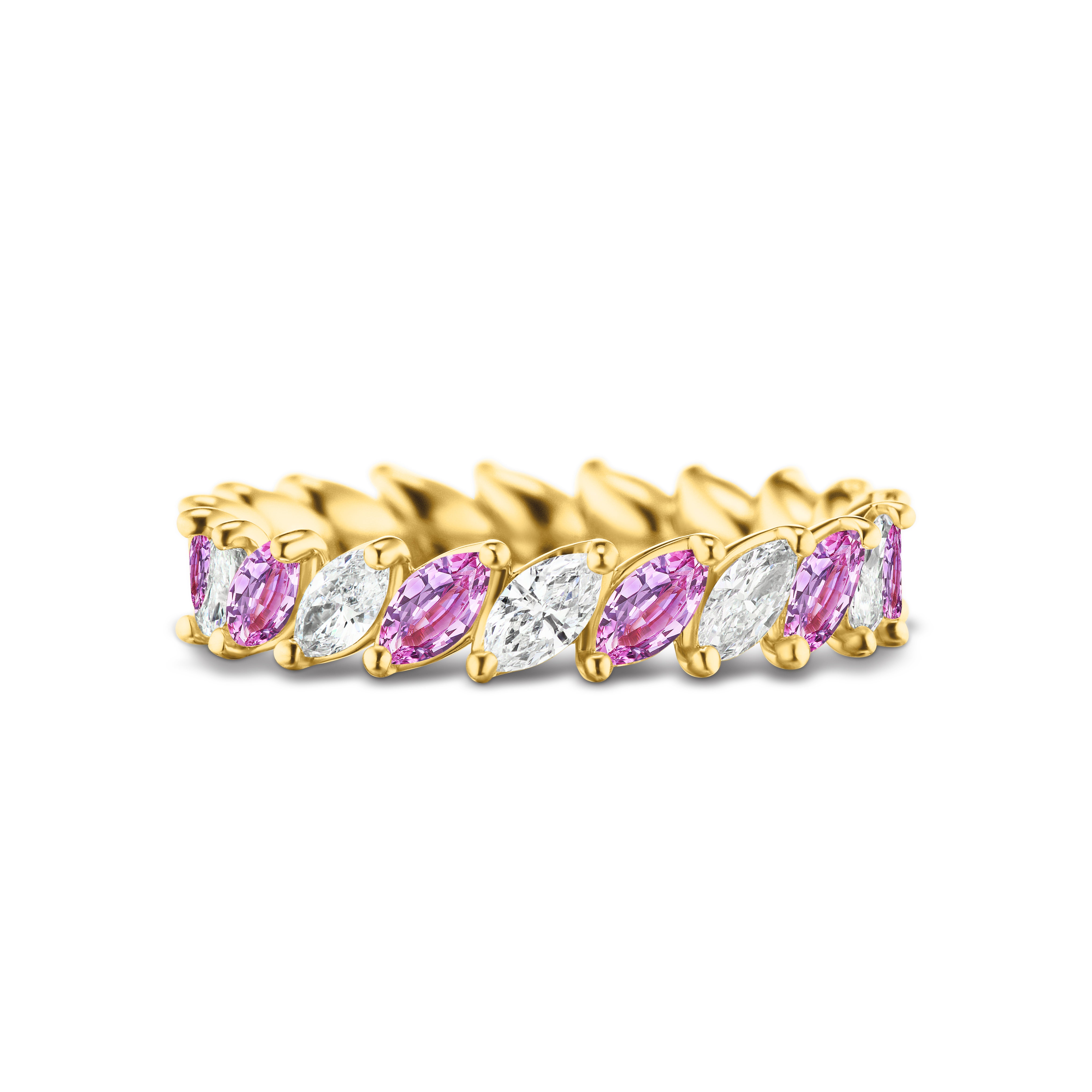 The Marching Marquise Eternity Band showcases alternating marquise-cut hot pink sapphires and diamonds, set in a continuous pattern on an 18K yellow gold band.
