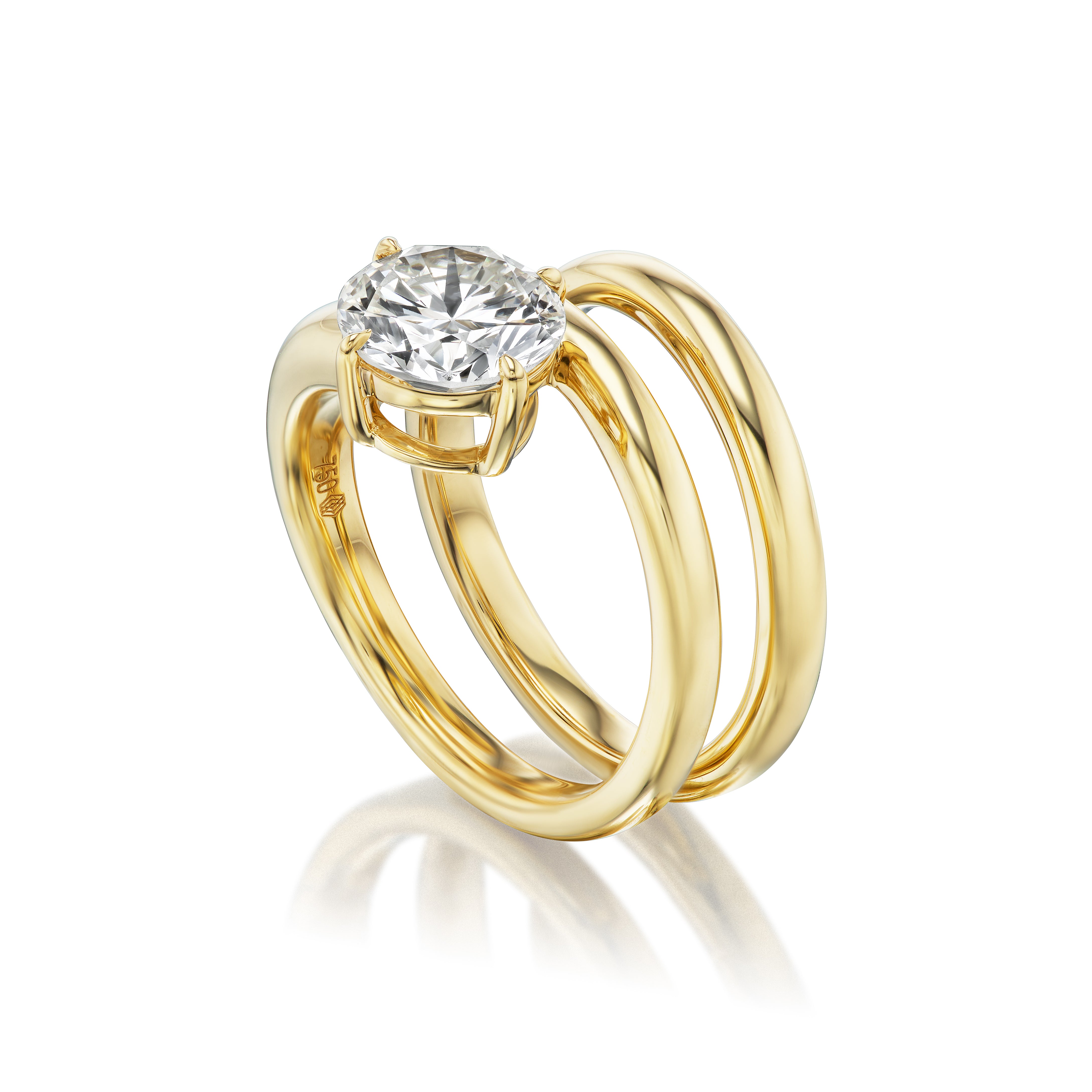 The Pinky Wraparound Ring With Diamond features two parallel gold bands joined at the base and a large round diamond in a four-prong setting at the center, displayed on a white reflective surface.