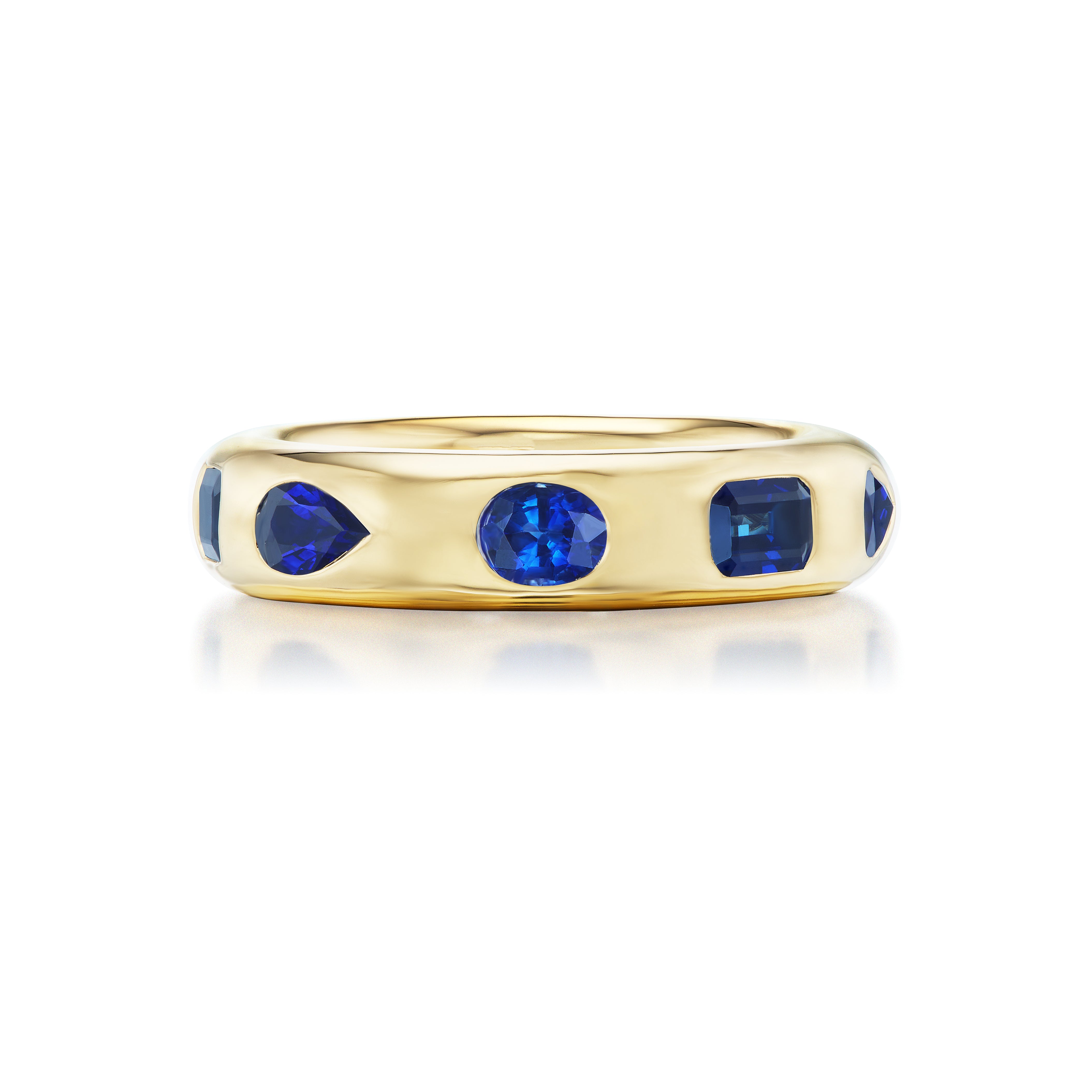 The Wedding Band in Yellow Gold with Burnish Set Mixed Shape Sapphires features round and emerald-cut sapphires set evenly around an 18K yellow gold band, shown on a white background.