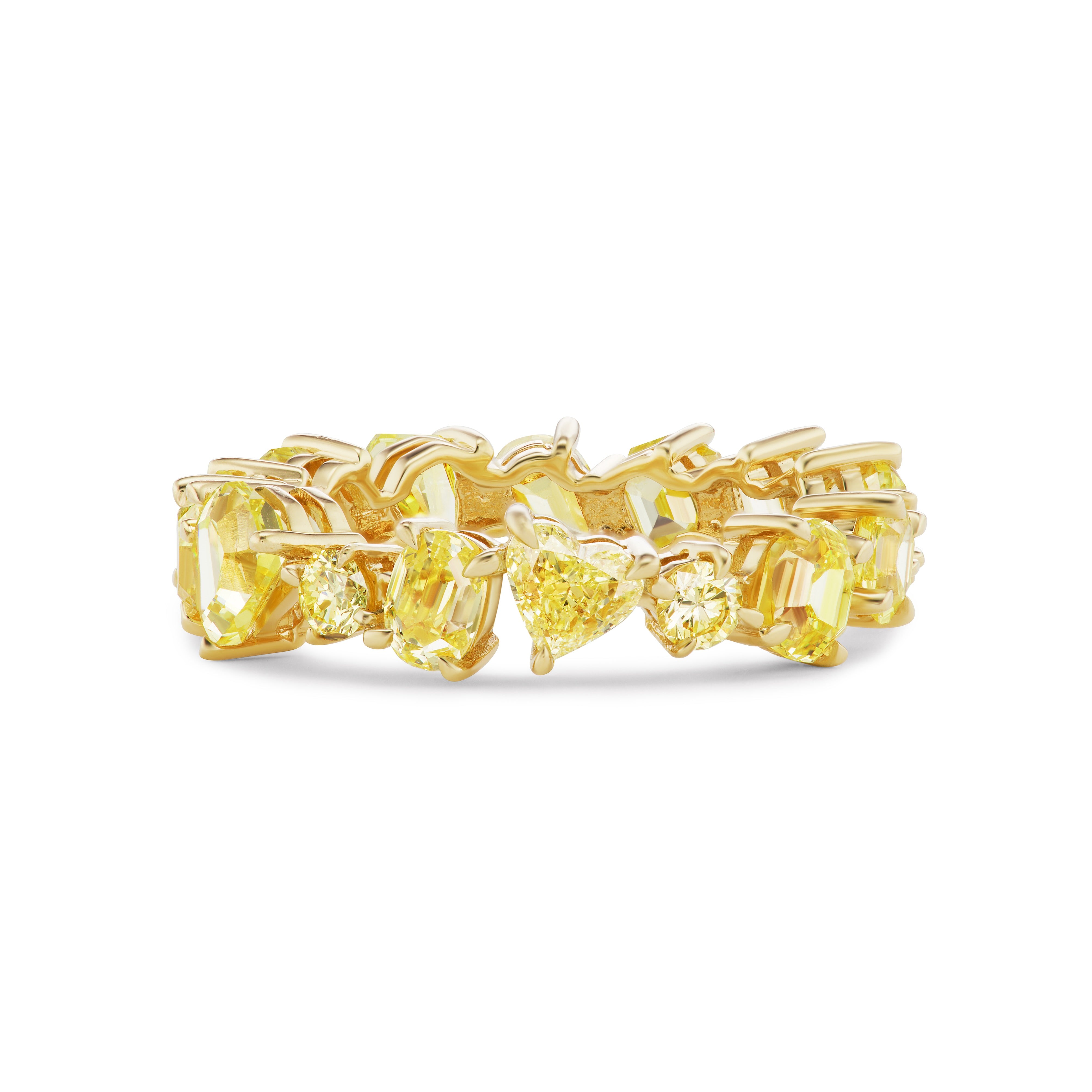 The Mixed Shape Eternity Band in Yellow Gold with Yellow Diamonds showcases a row of emerald, heart, and oval yellow diamonds set in prongs for a vibrant, luxurious look in 18K yellow gold.