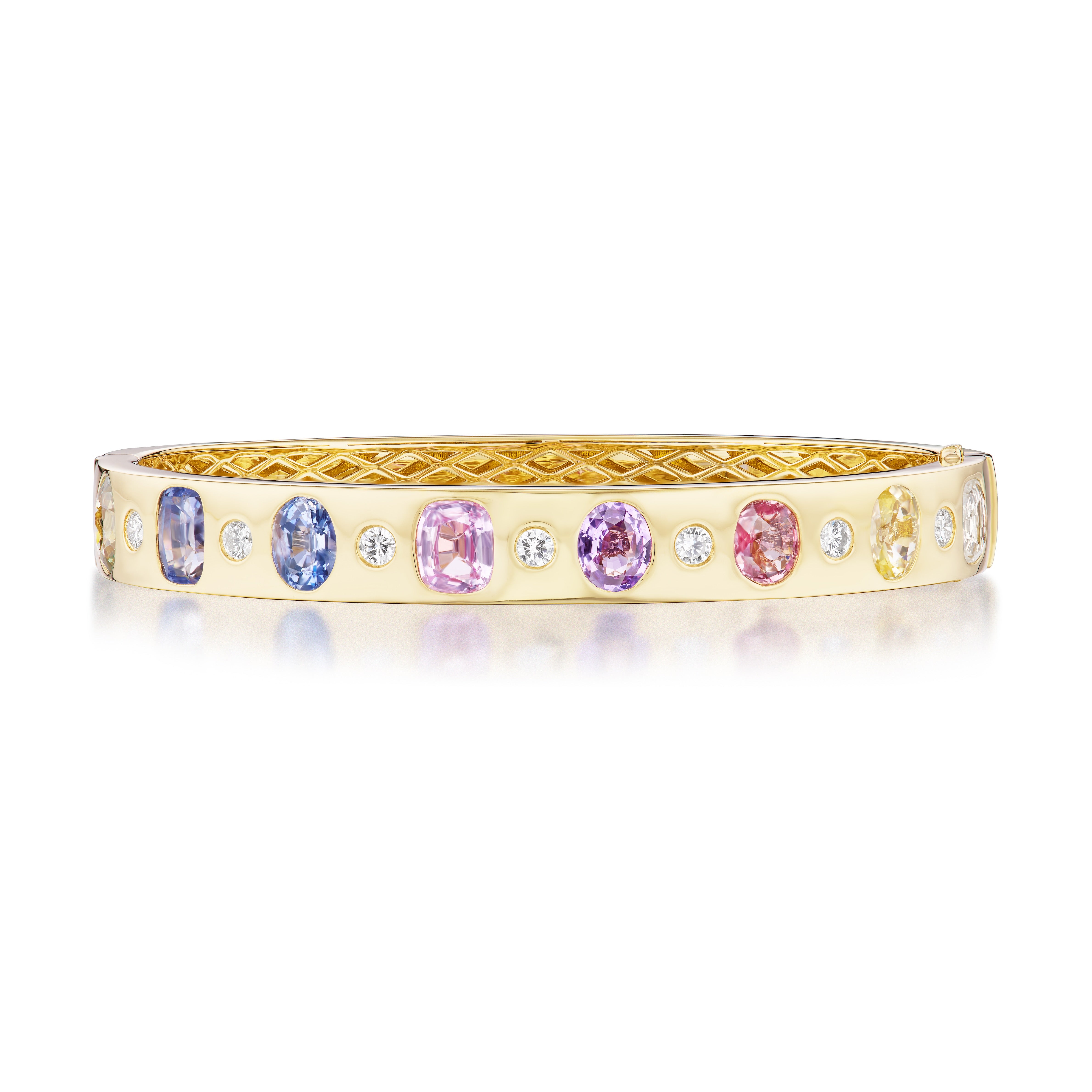 The Burnish Set Multicolor, Mixed Shape, Diamond and Sapphire Bangle in Yellow Gold showcases pastel pink, purple, and blue sapphires with round white diamonds set in a polished 18k yellow gold band.