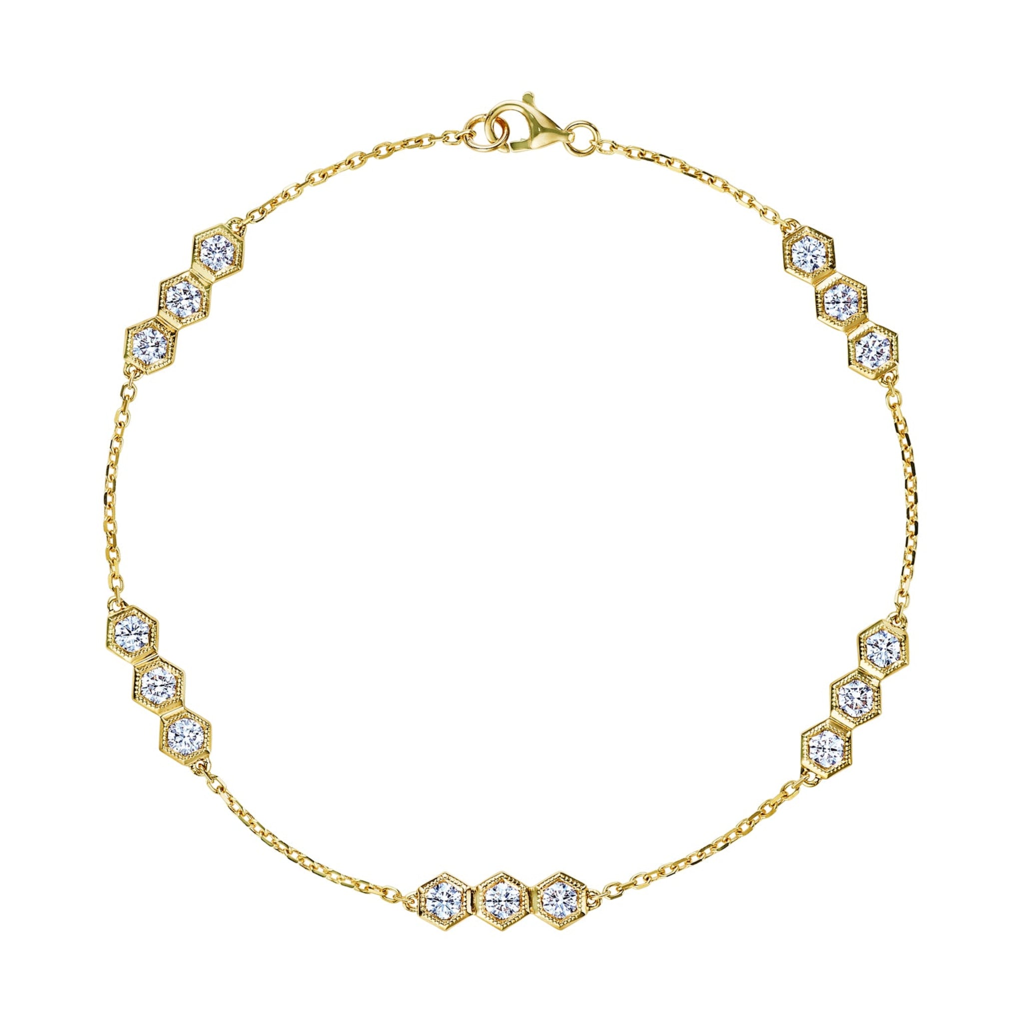 The Serpentine Station Bracelet with Hexagon Diamond Trios is an 18k gold bracelet featuring small hexagonal clusters of round brilliant diamonds, evenly spaced along a fine chain with a lobster claw clasp.