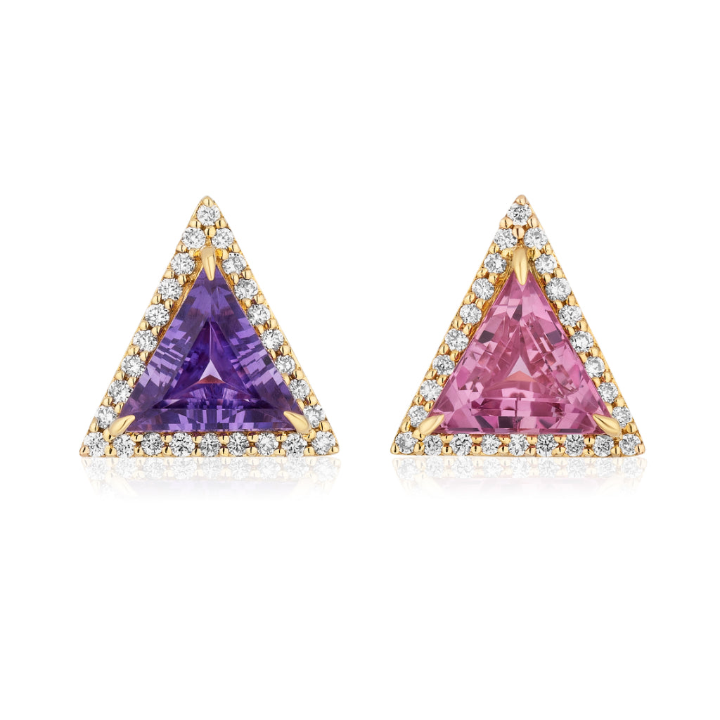 This & That Pavé Trinity Studs feature trillion-cut purple and pink sapphires, each framed by a pavé of white diamonds, all set in elegant 18K yellow gold.