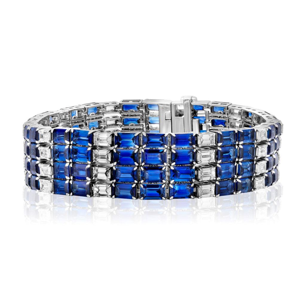 The Sapphire and Diamond Striped Evening Bracelet features alternating rows of blue sapphires and diamonds set in 18K white gold for a bold, elegant, and symmetrical look.