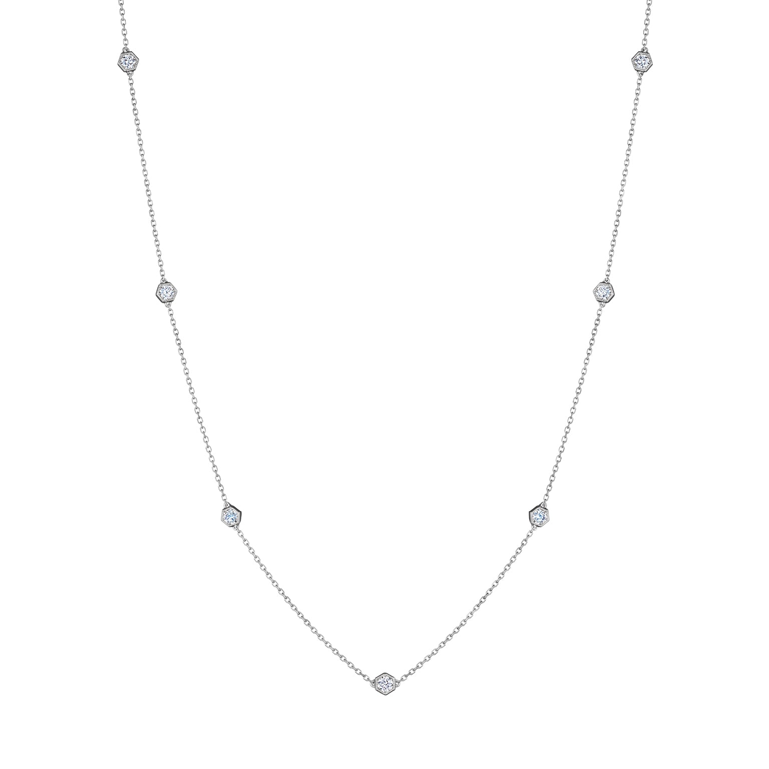 Small Serpentine Station Necklace in white gold, featuring hexagon bezel-set diamonds spaced along a fine chain, displayed on a white background.