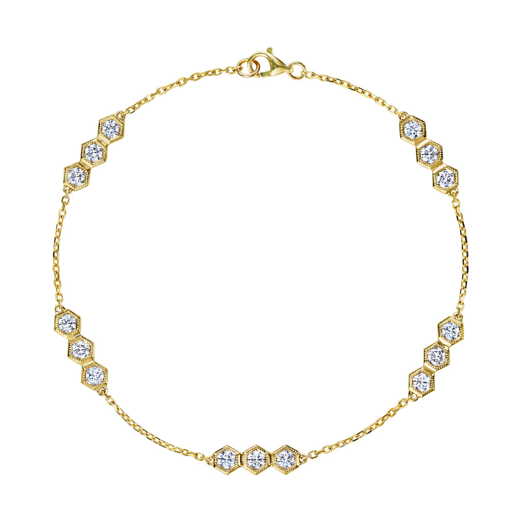 The Serpentine Station Bracelet features trio hexagon bezel-set diamonds in 18K gold, with sparkling clusters evenly spaced around the chain and secured by a lobster clasp.