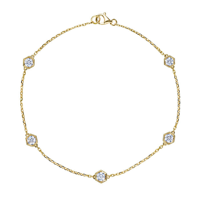 The Serpentine Station Bracelet features five round diamonds in hexagon bezels along an 18K gold chain with a lobster clasp—a refined piece perfect for any occasion.