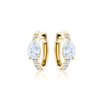 Pavé Huggie with Pear Diamonds: 18k gold hoop earrings with a pear-shaped diamond center and small round stones along the front, shown on a white background.