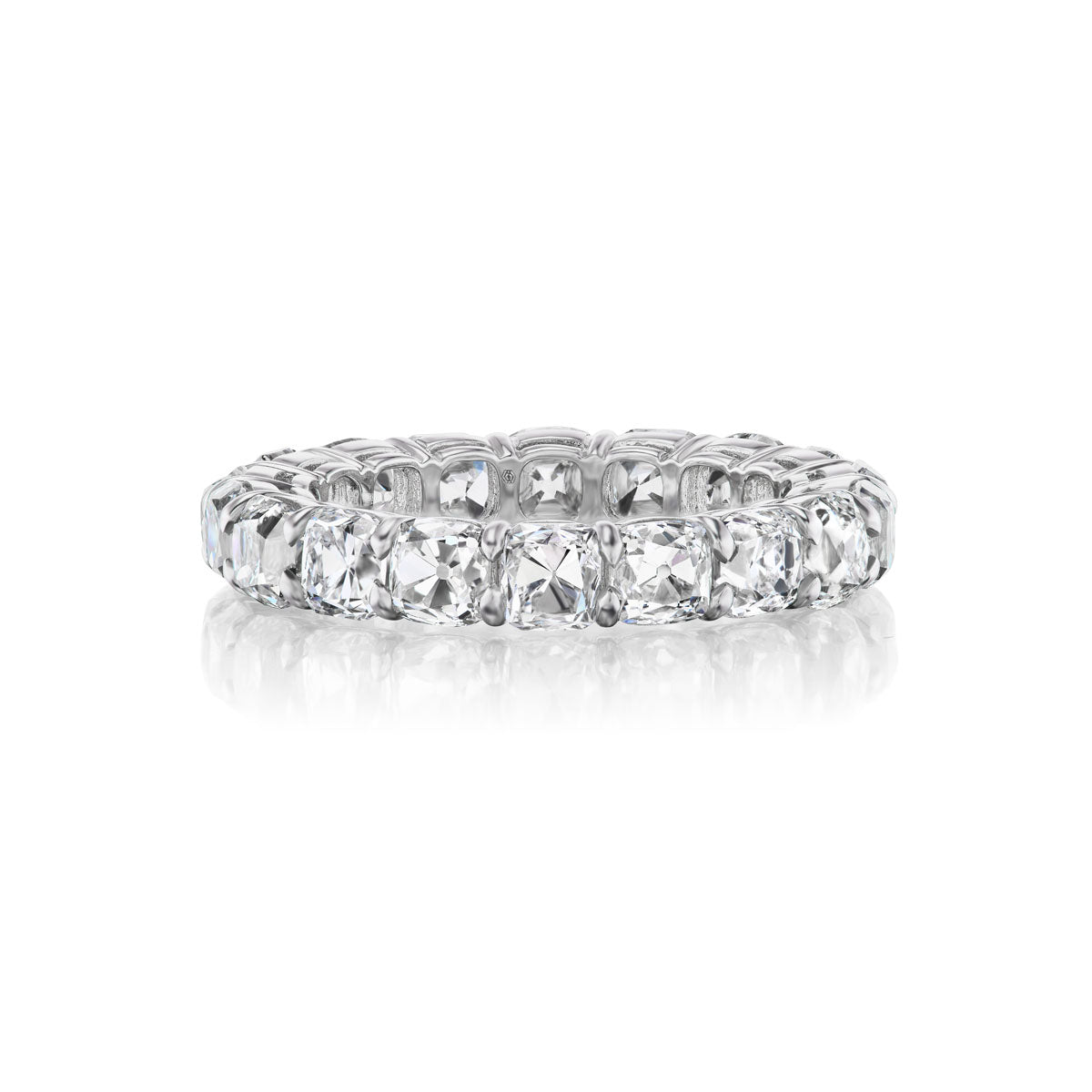 The Old Mine Cut Diamond Eternity Band features cushion-cut diamonds set in 18k white gold, showcased on a white background. Ideal for bridal or celebration rings.