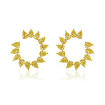 The Yellow Diamond Sunshine Front-to-Back Hoops are crafted from 18k yellow gold, featuring fancy yellow diamonds in teardrop shapes arranged symmetrically for a radiant, halo-like effect.