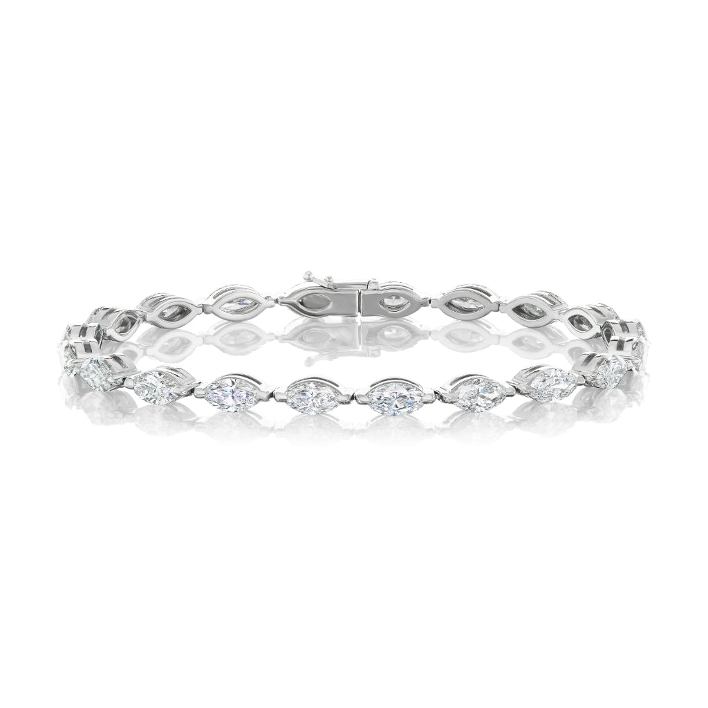 The East-West Marquise Diamond Tennis Bracelet in 18K white gold features a row of marquise-shaped links, each set with a sparkling diamond, showcased on a white background.