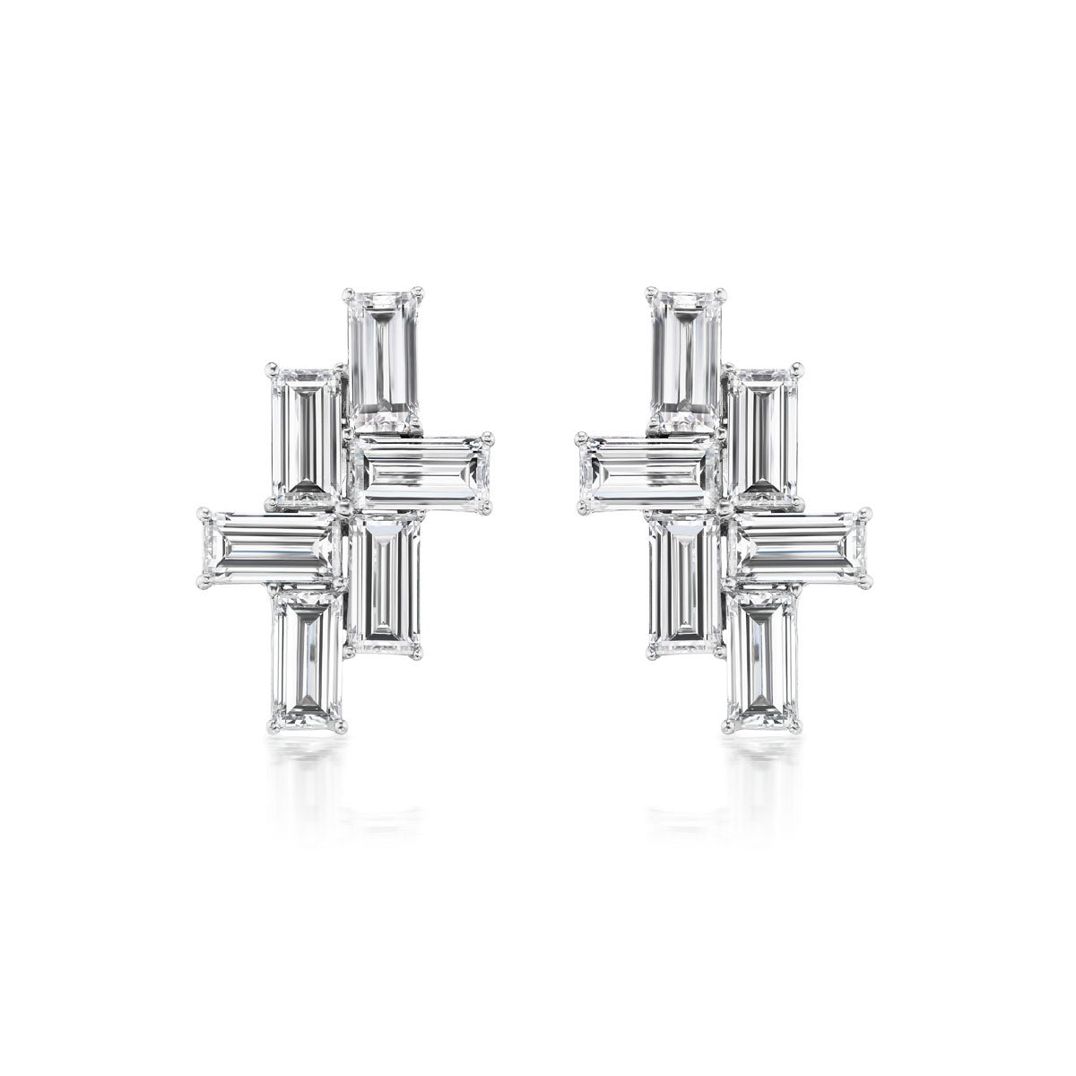 The Tetris Studs with Baguette Diamonds in White Gold showcase baguette-cut diamonds arranged in a geometric cross pattern, set against a white gold background for a modern, elegant look.